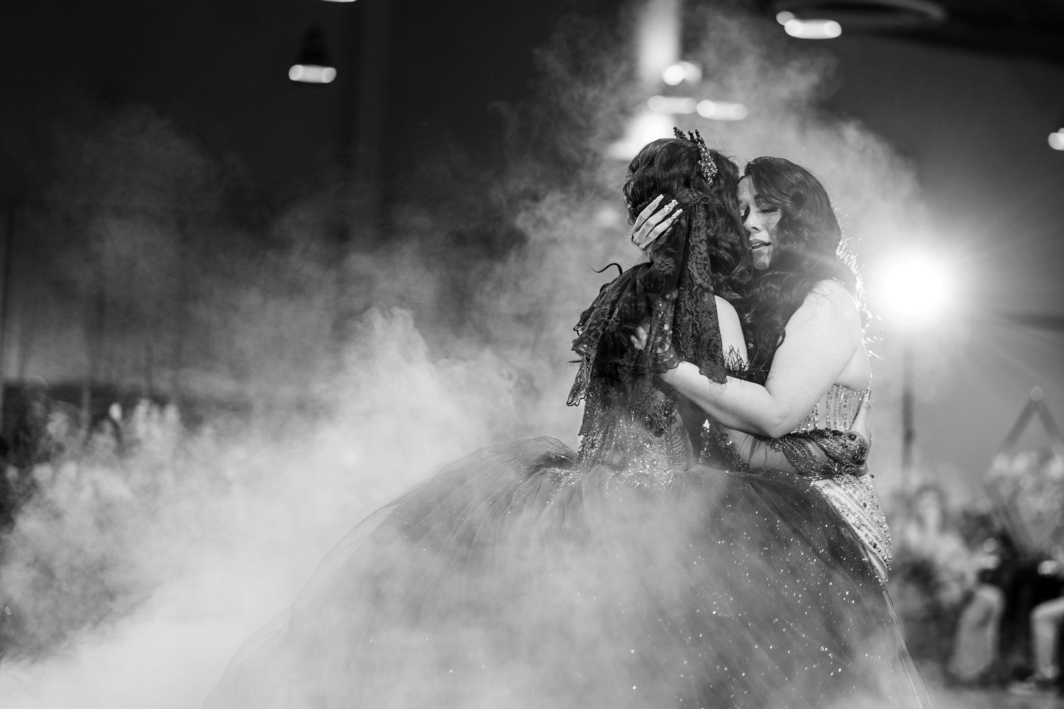 Mother-daughter quince dance, smoke effect, black & white emotional moment by The Padillas, documentary quince photos.