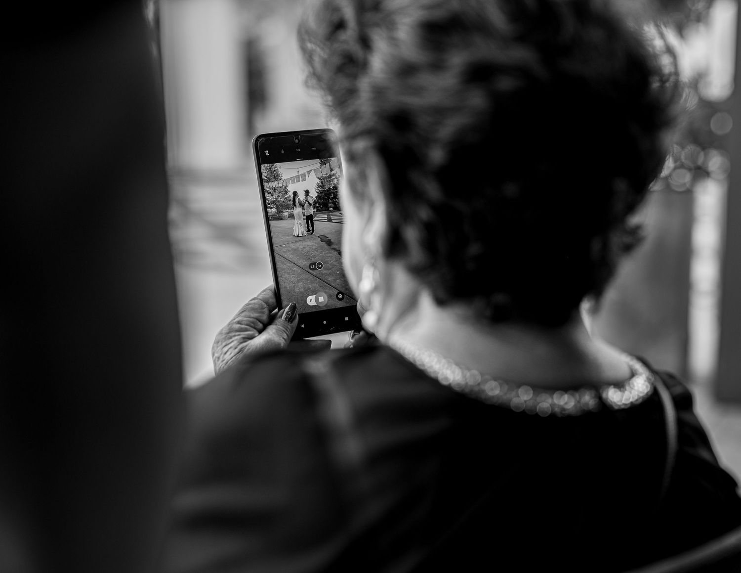 Candid wedding ceremony moment with flower girl walking down aisle, The Ranch at Lone Oak, captured by The Padillas.