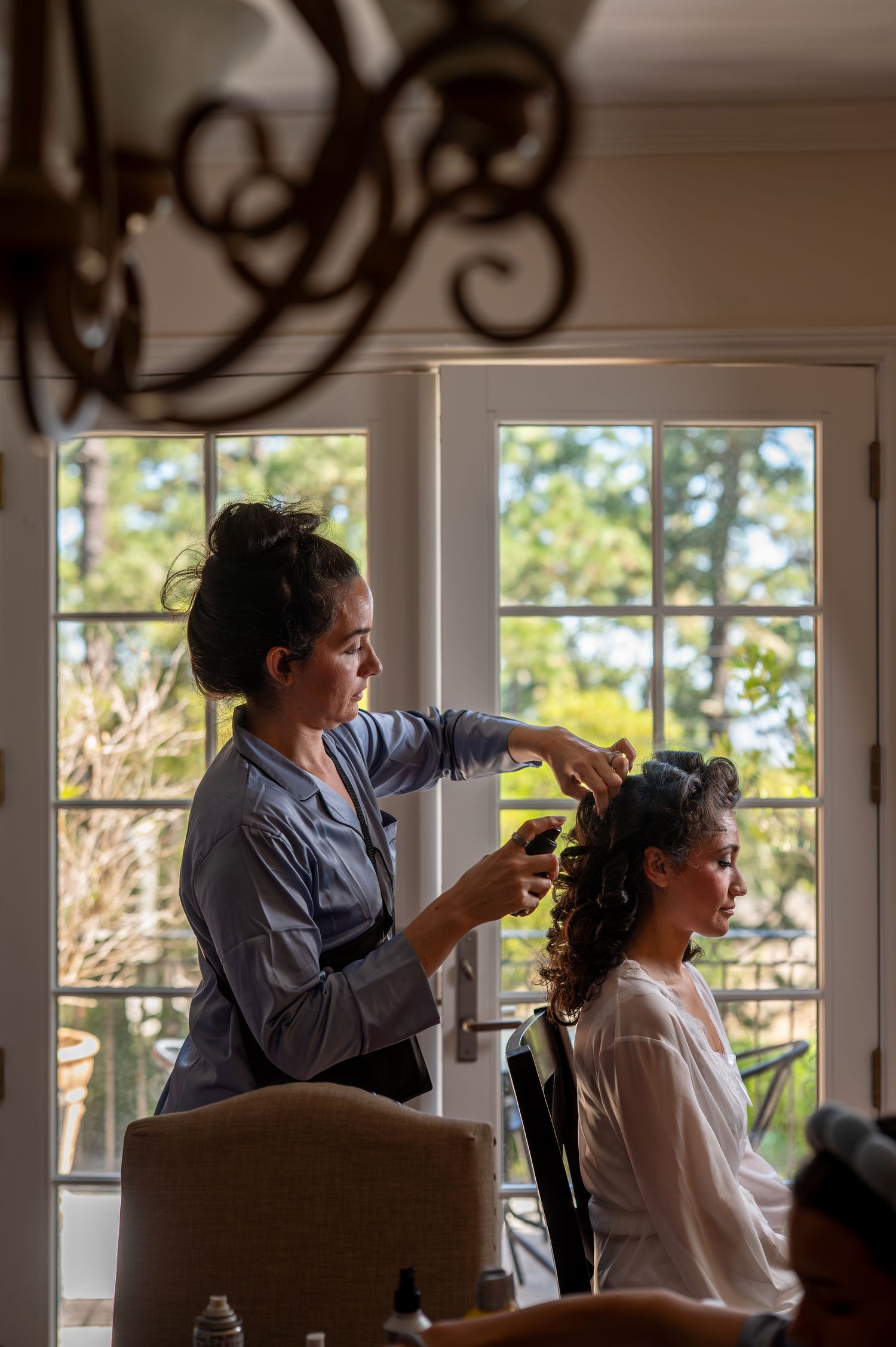 Candid moment of bride getting ready for wedding in Monterey captured by The Padillas documentary photographers.