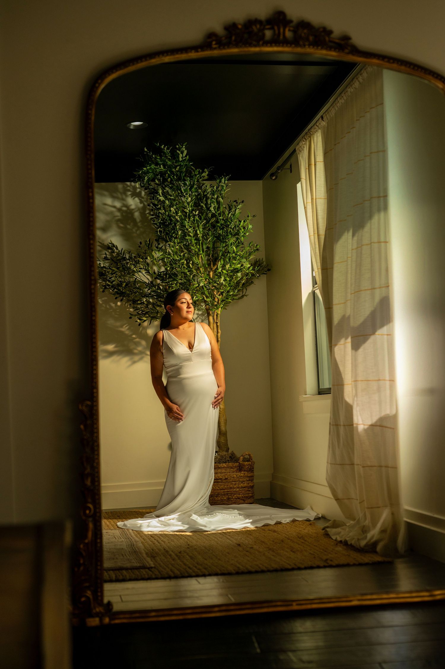 Bride portrait standing in front of vintage mirror, golden light, The Ranch at Lone Oak wedding photographer The Padillas.