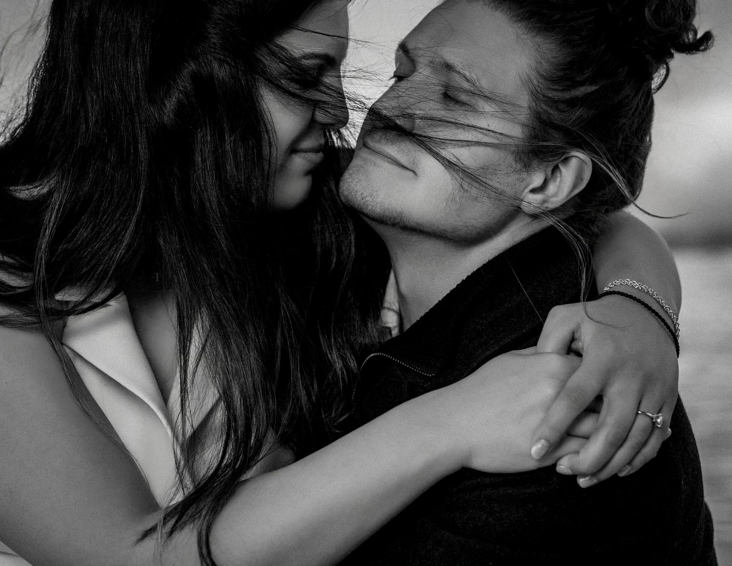 Close-up of engaged couple embracing with windblown hair, Marin boat engagement session