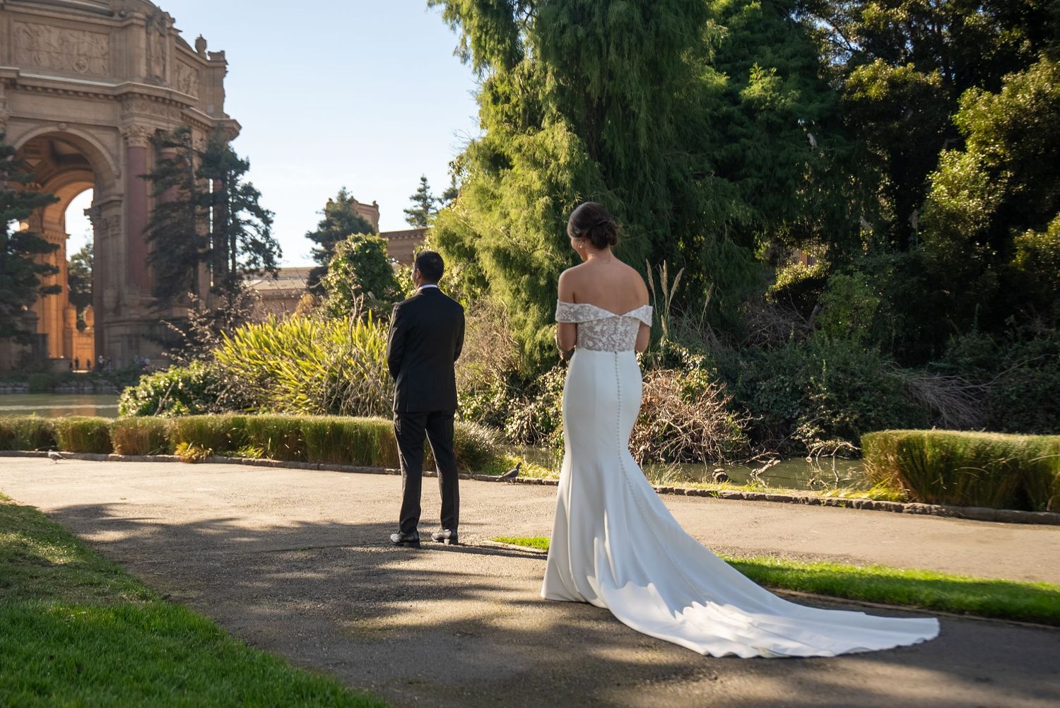 Bride and groom first look at Palace of Fine Arts, San Francisco wedding photography by The Padillas.
