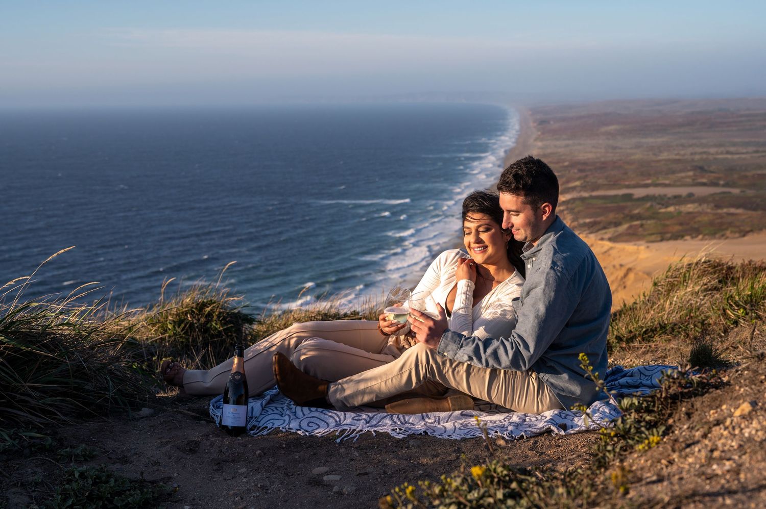 Engagement picnic overlooking ocean cliffs at Point Reyes, California