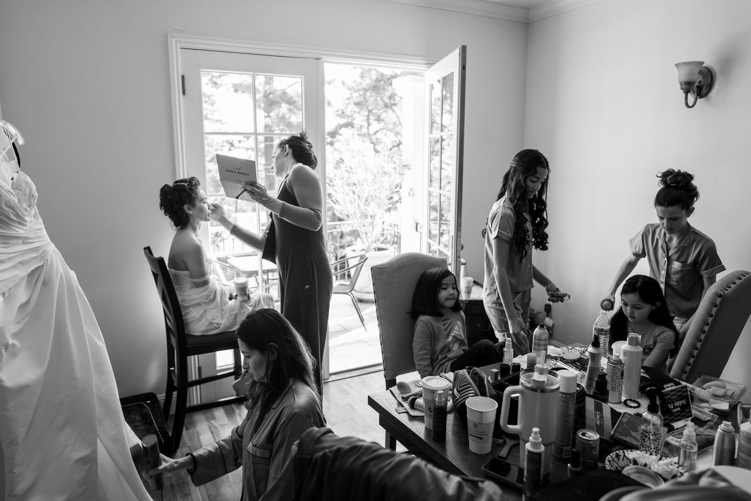 Candid moment of bride getting ready for wedding in Monterey captured by The Padillas documentary photographers.