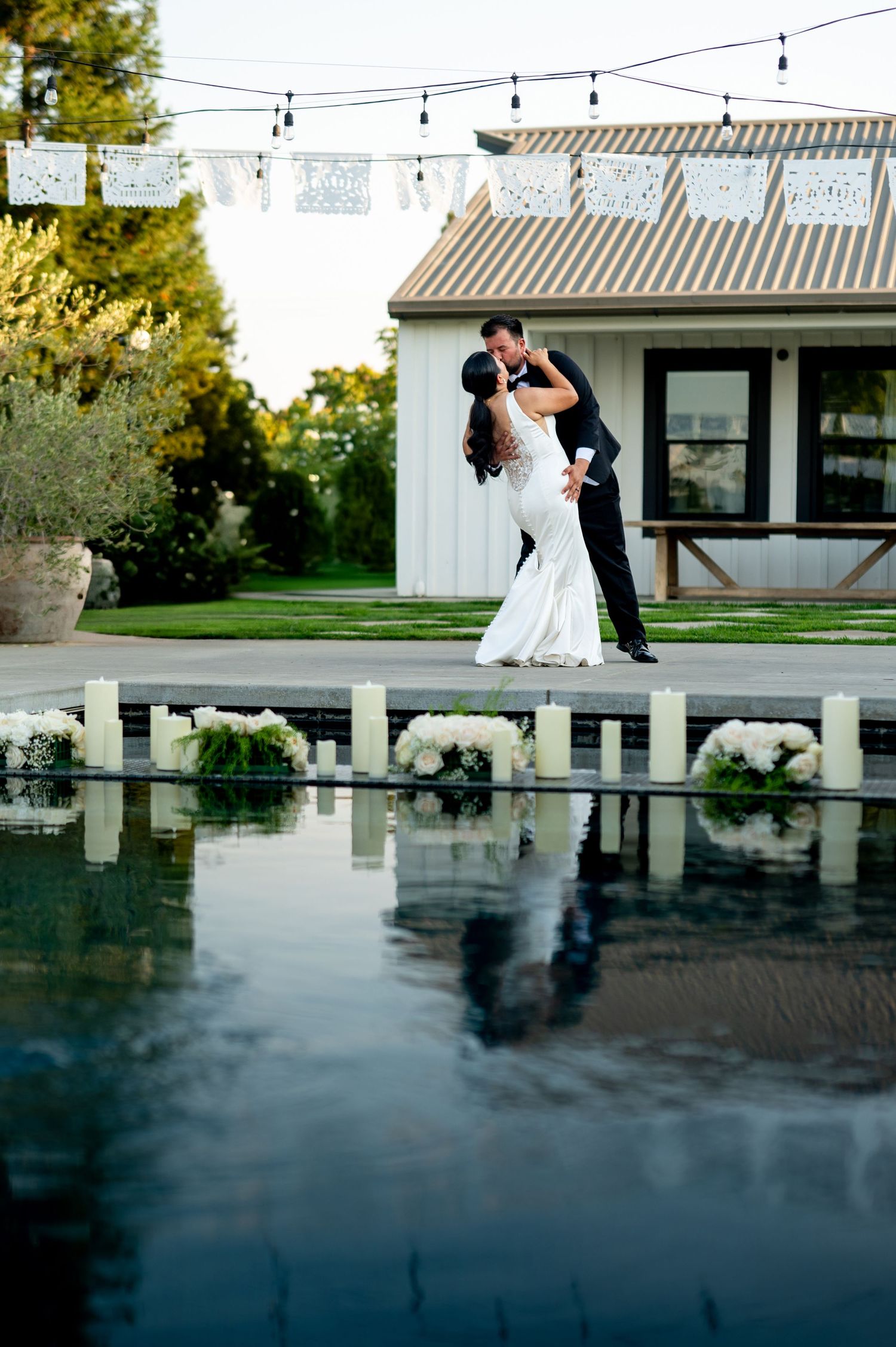 Bride and groom first dance by the pool at The Ranch at Lone Oak, California wedding venue, photographed by The Padillas.