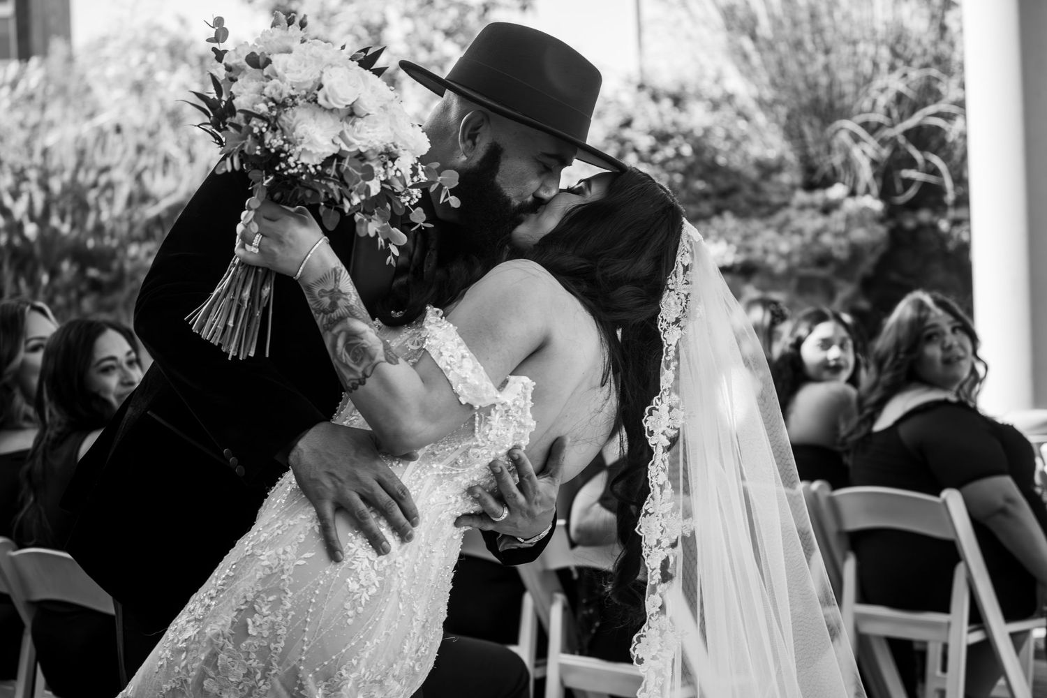 Black‑and‑white candid wedding portrait at Sacramento Cathedral, romantic storytelling photography