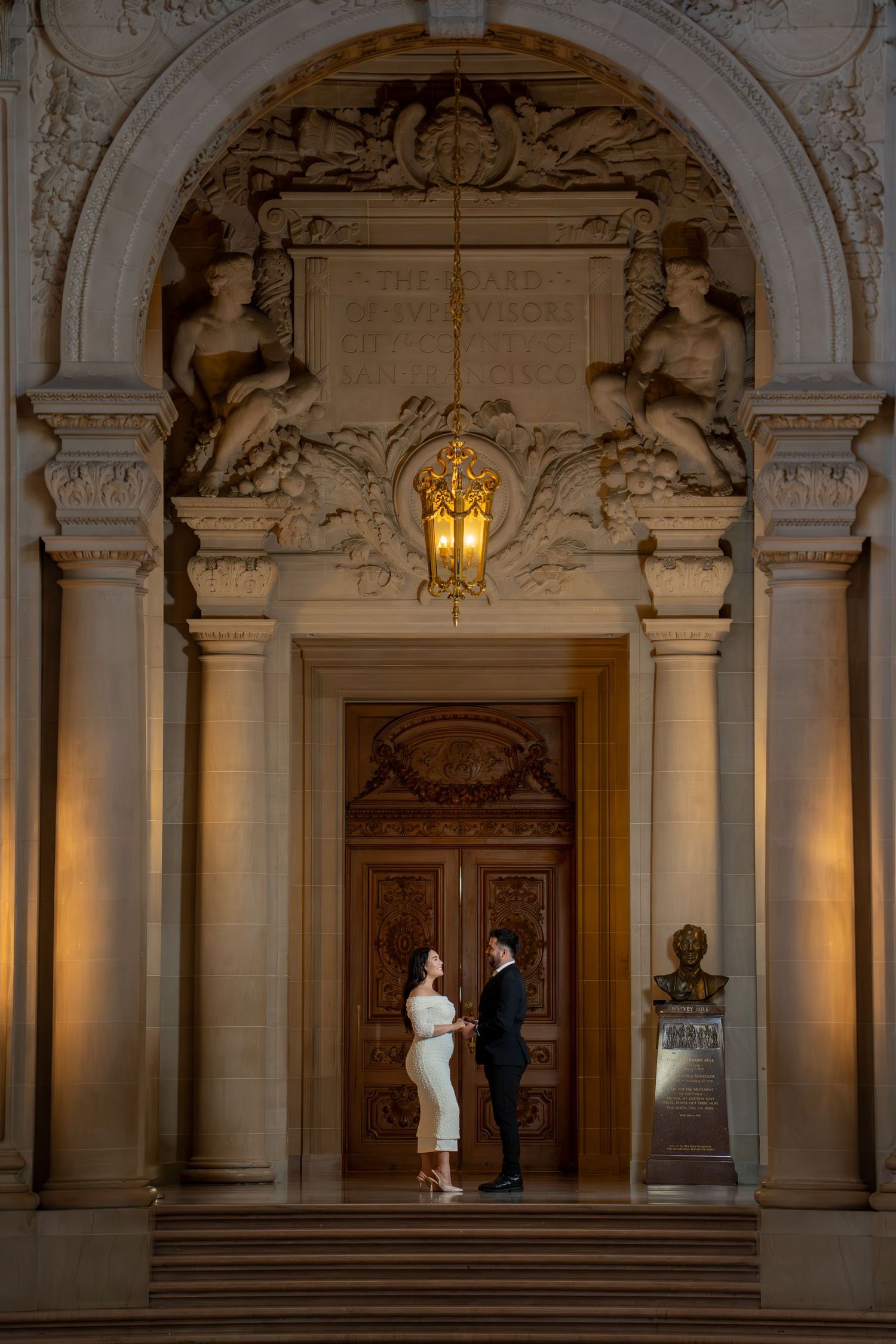 Couple eloping at San Francisco City Hall under grand architecture, luxury elopement photography by The Padillas