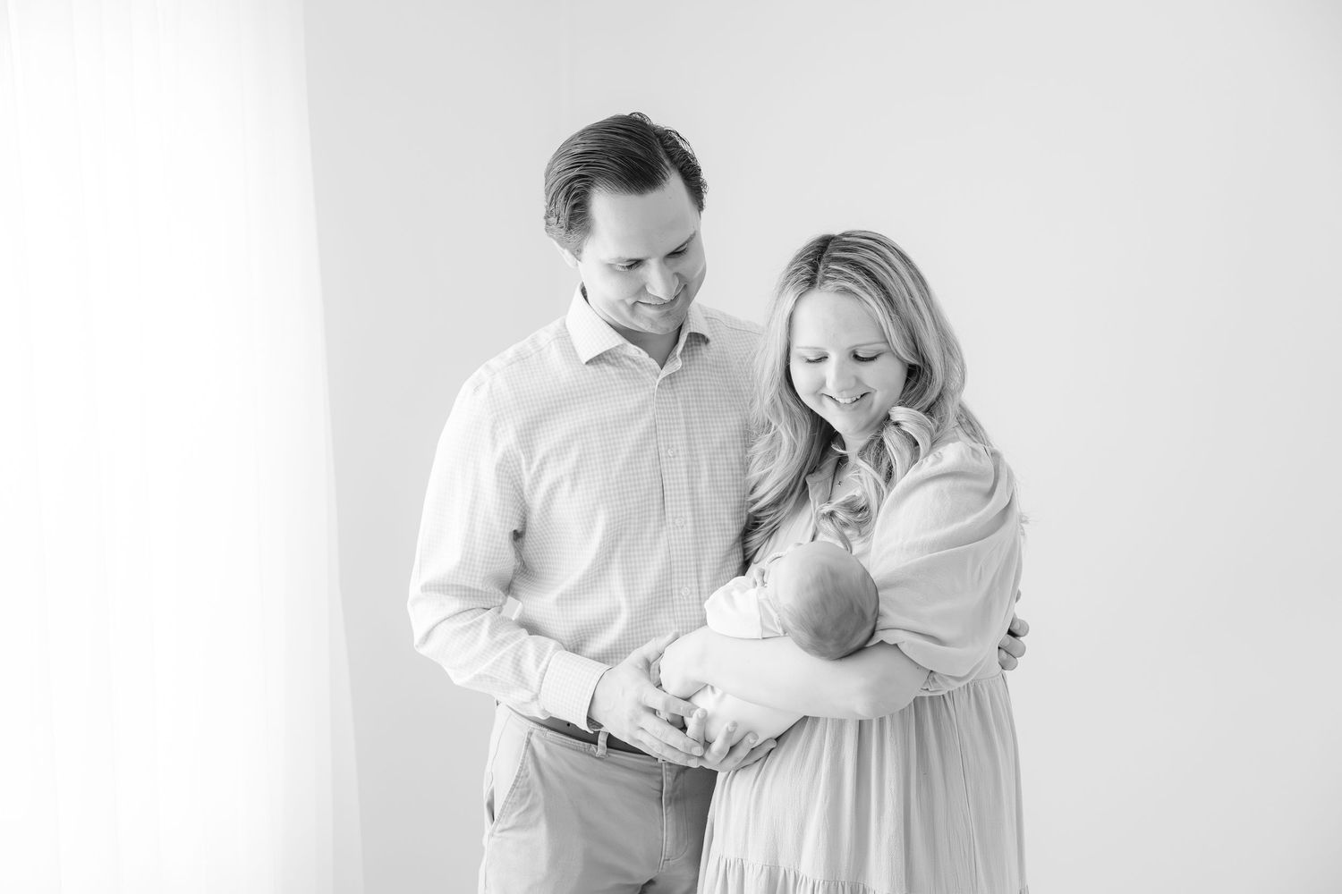 Newborn photography studio in Hendersonville NC capturing soft, timeless newborn portraits in natural light.