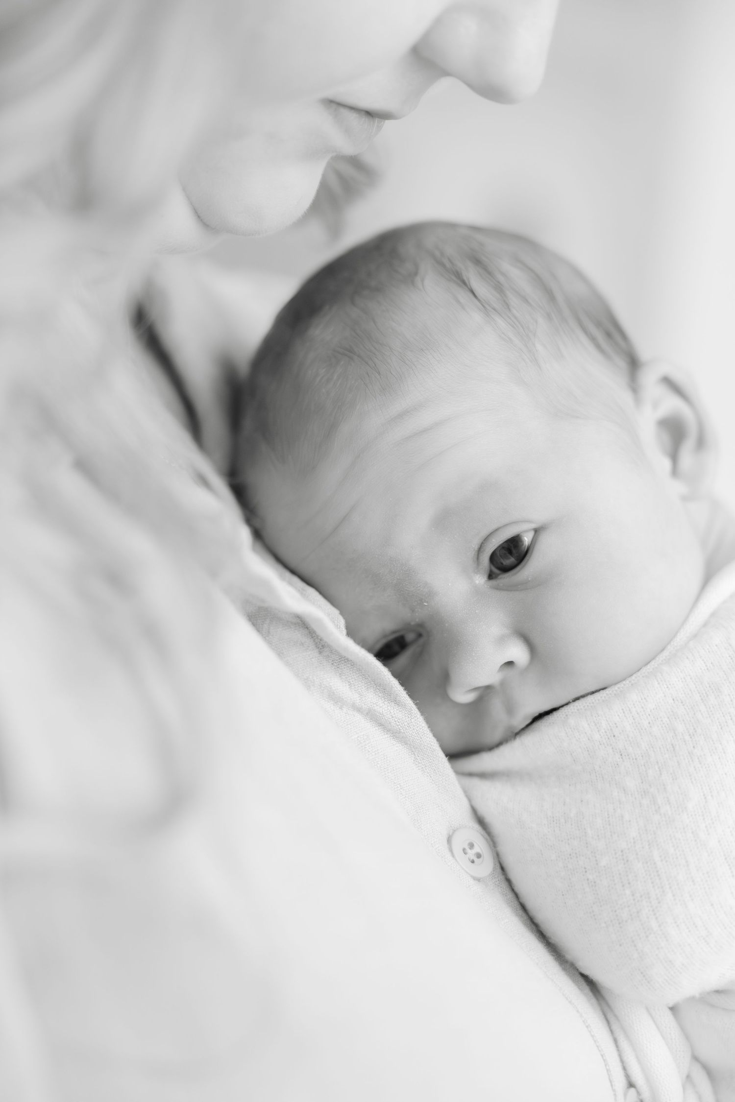 Newborn photography studio in Hendersonville NC capturing soft, timeless newborn portraits in natural light.