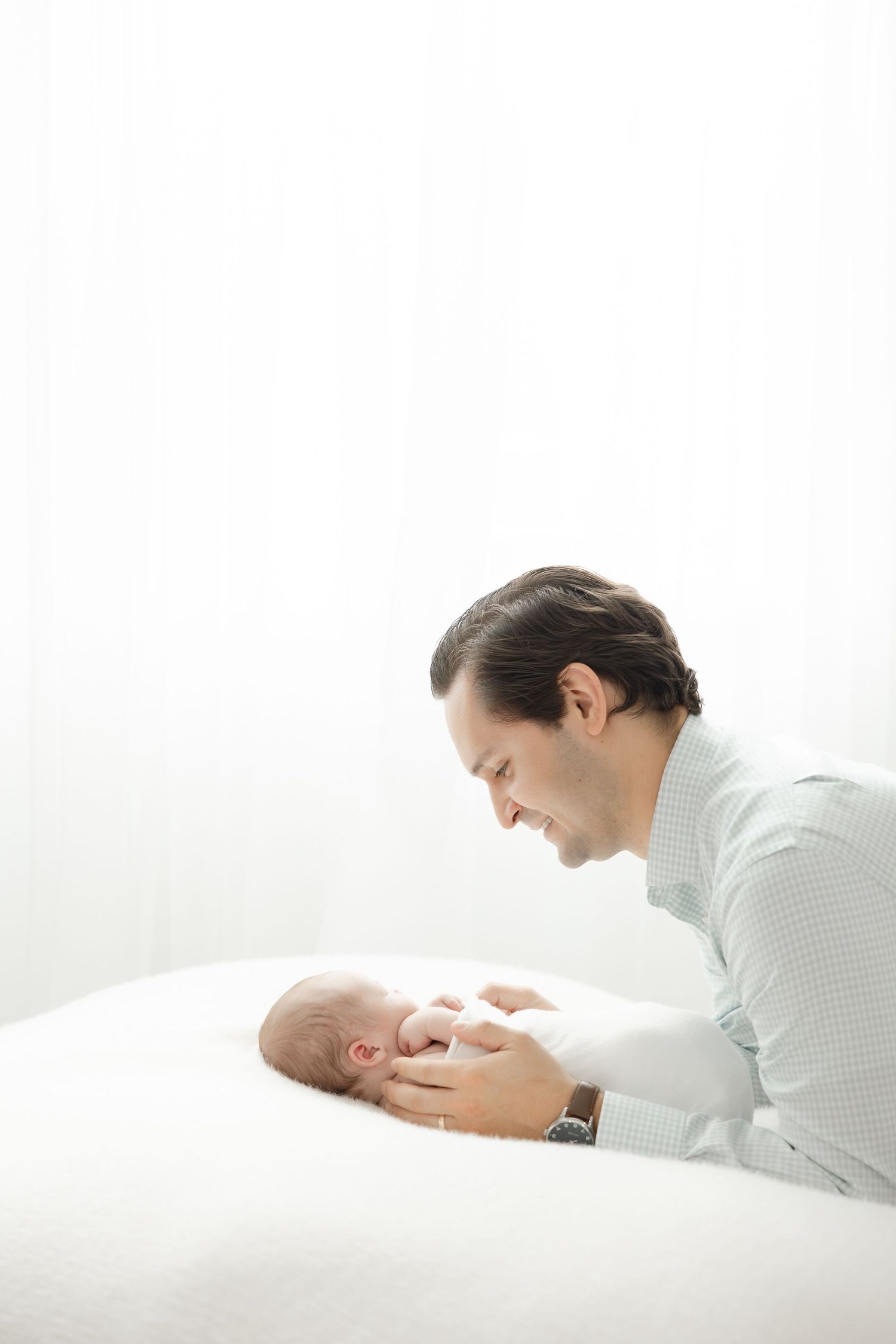 Newborn photography studio in Hendersonville NC capturing soft, timeless newborn portraits in natural light.