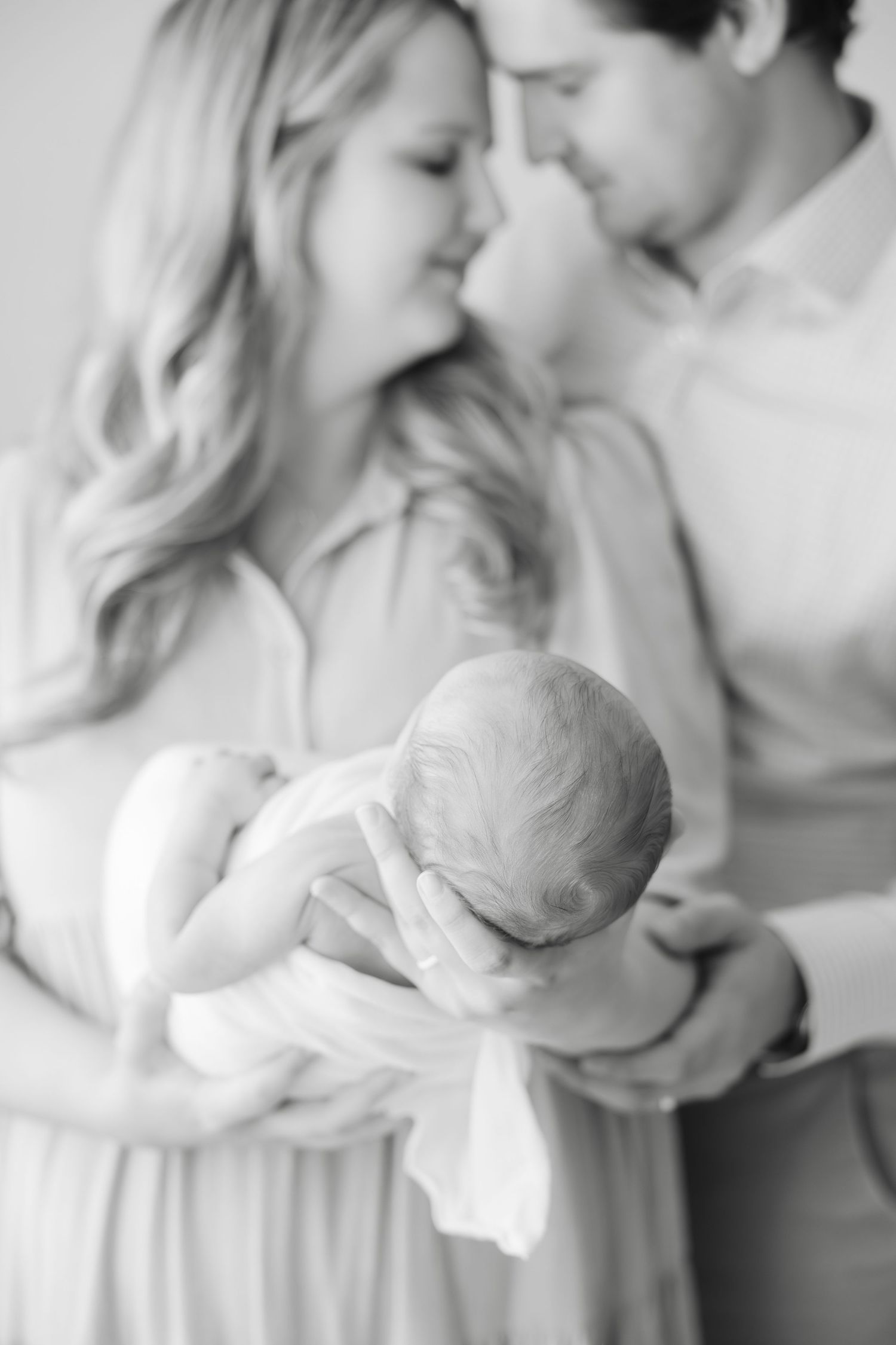 Newborn photography studio in Hendersonville NC capturing soft, timeless newborn portraits in natural light.