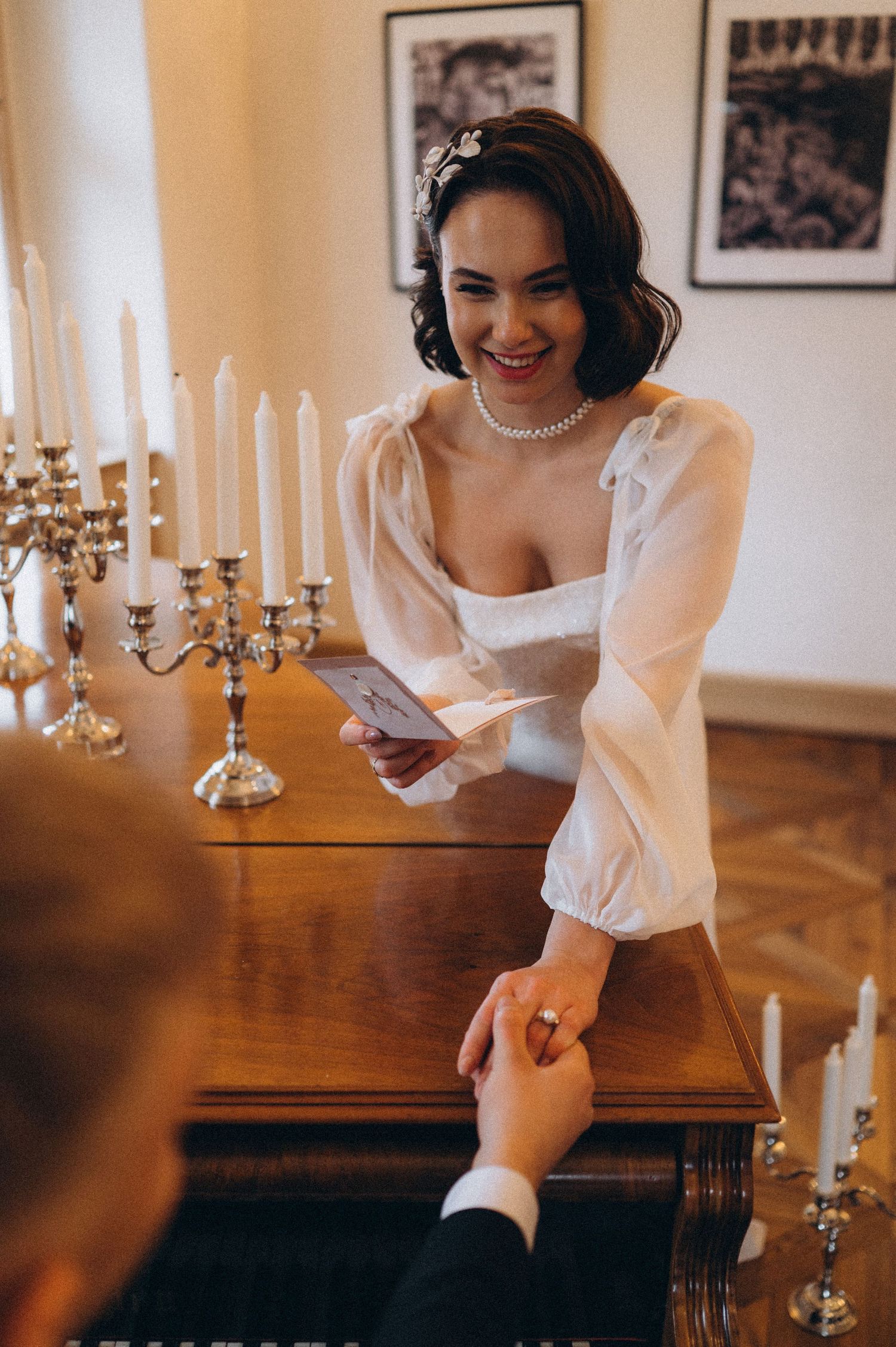 Bride gently holding the groom’s hand during their wedding photoshoot in Tenerife.
