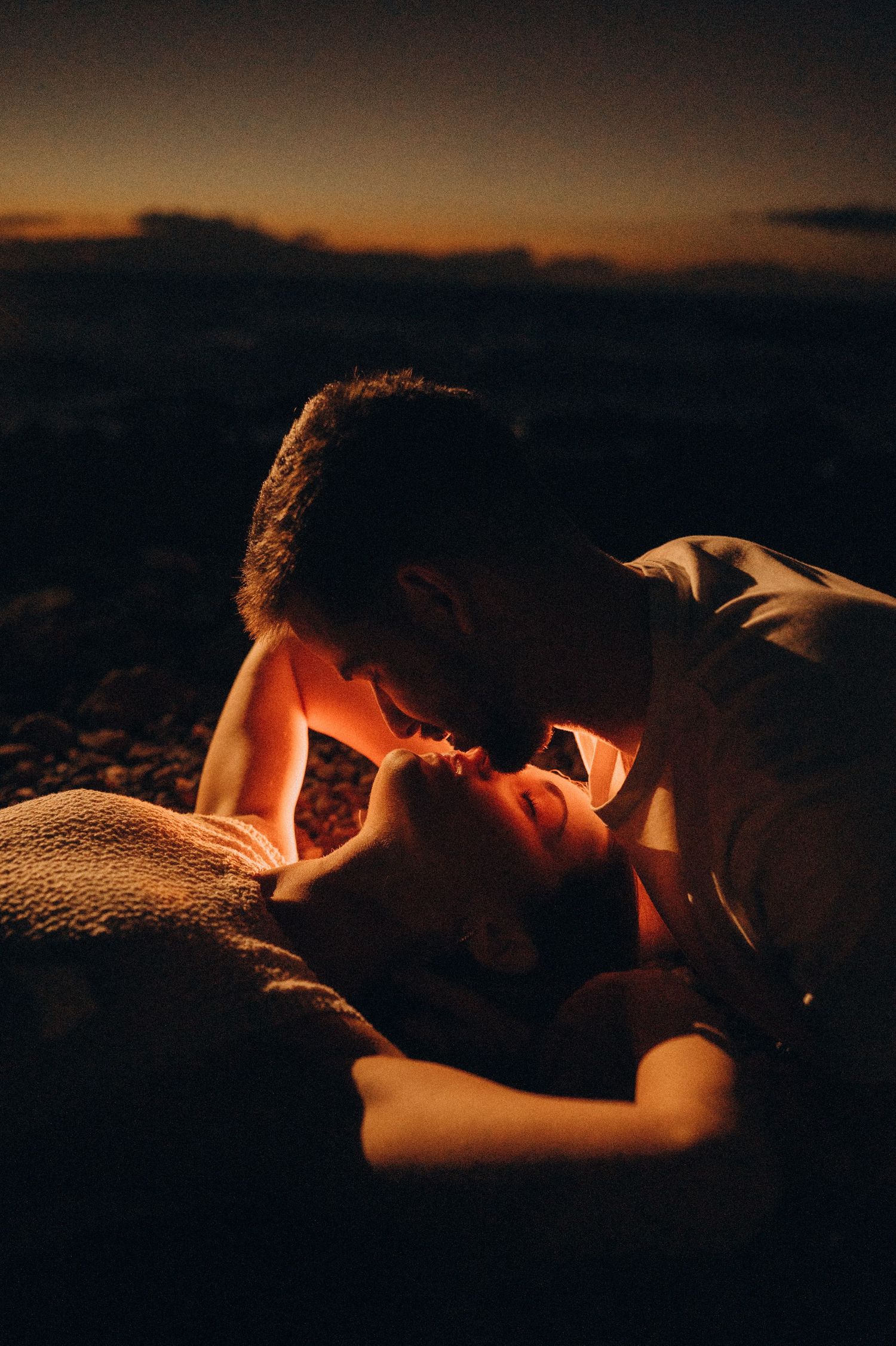 Romantic close-up of couple about to kiss, sharing tender gaze