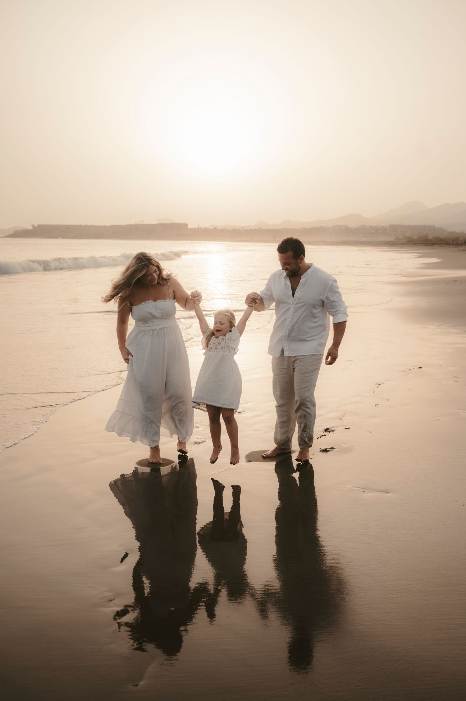 Emotional moment of family walking together during sunset at Playa La Tejita