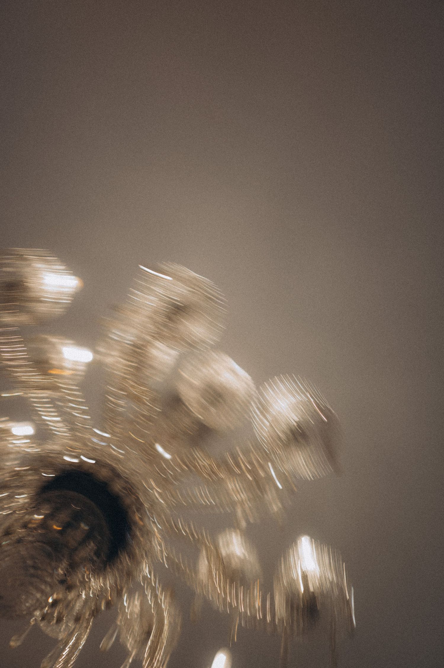 Soft blurred ceiling light creating an elegant atmospheric mood in a wedding venue.