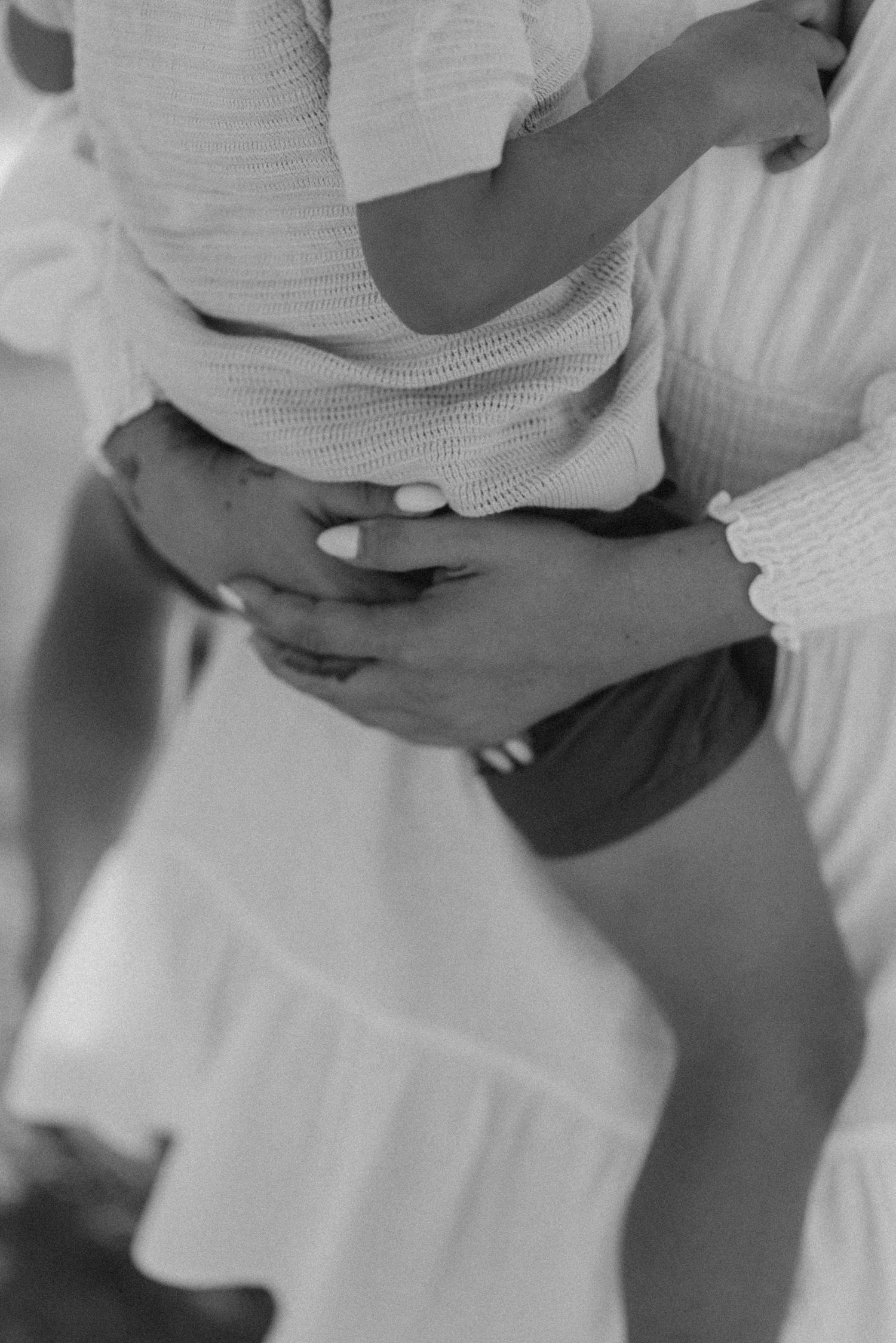 Intimate black and white portrait of mother holding child, Montaña Roja