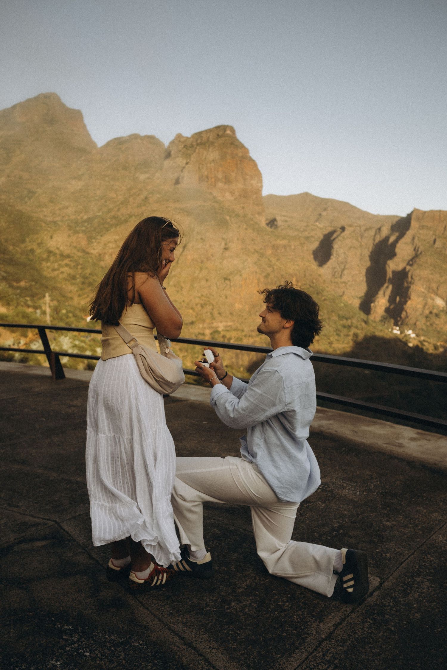 Surprise proposal in Masca, Tenerife with a stunning mountain backdrop at golden hour.