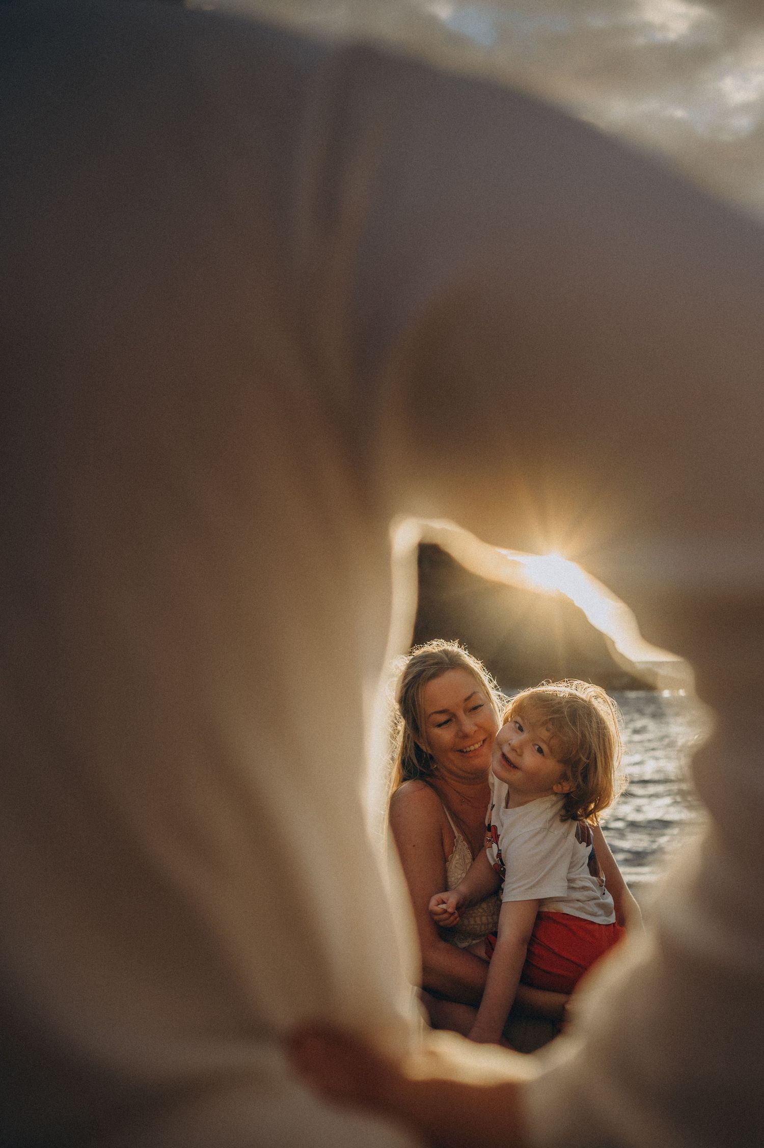 Tender moment between parent and child during family photoshoot in Tenerife.