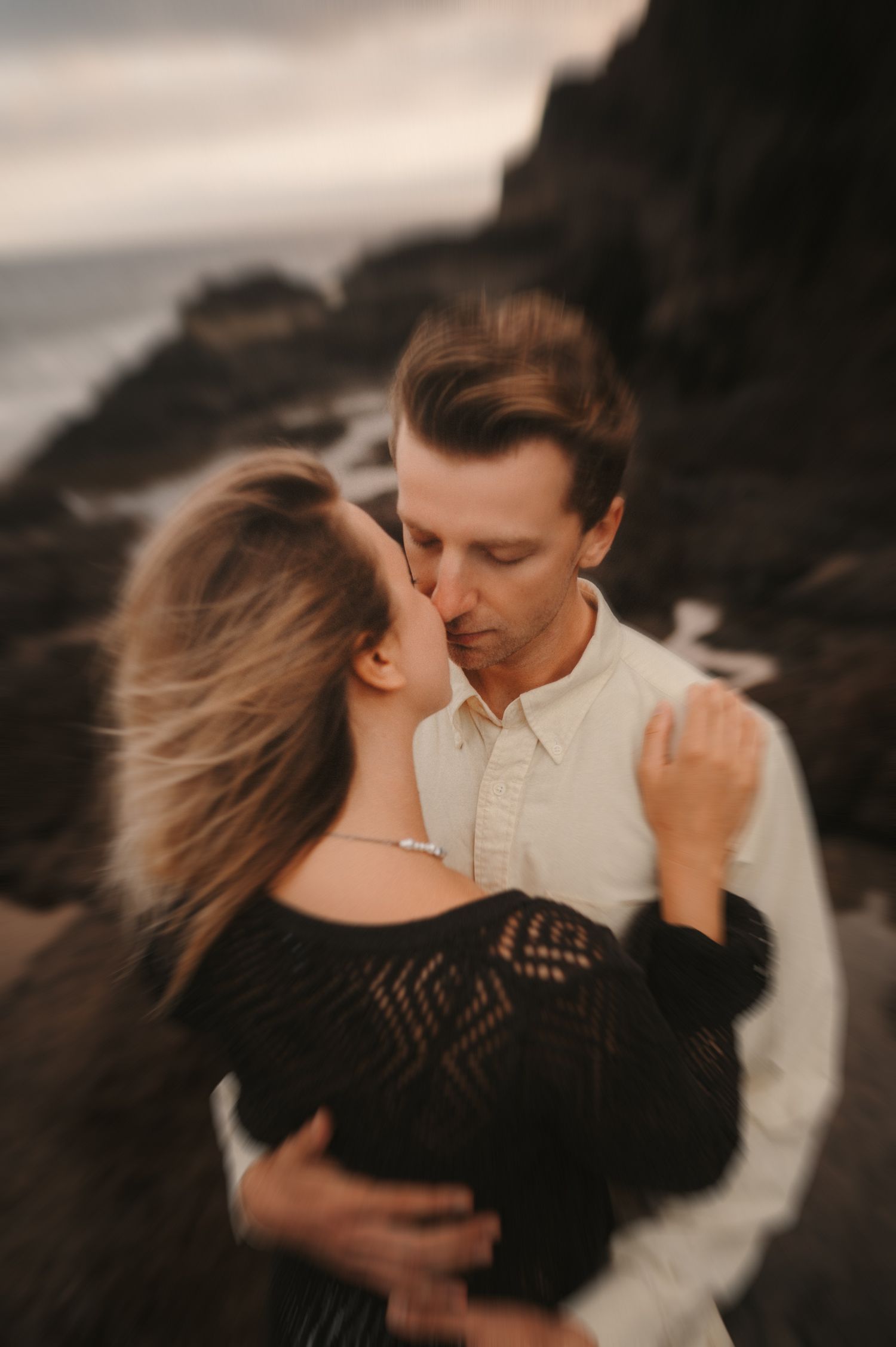 Loving couple embracing and sharing a romantic moment during a photoshoot in Tenerife