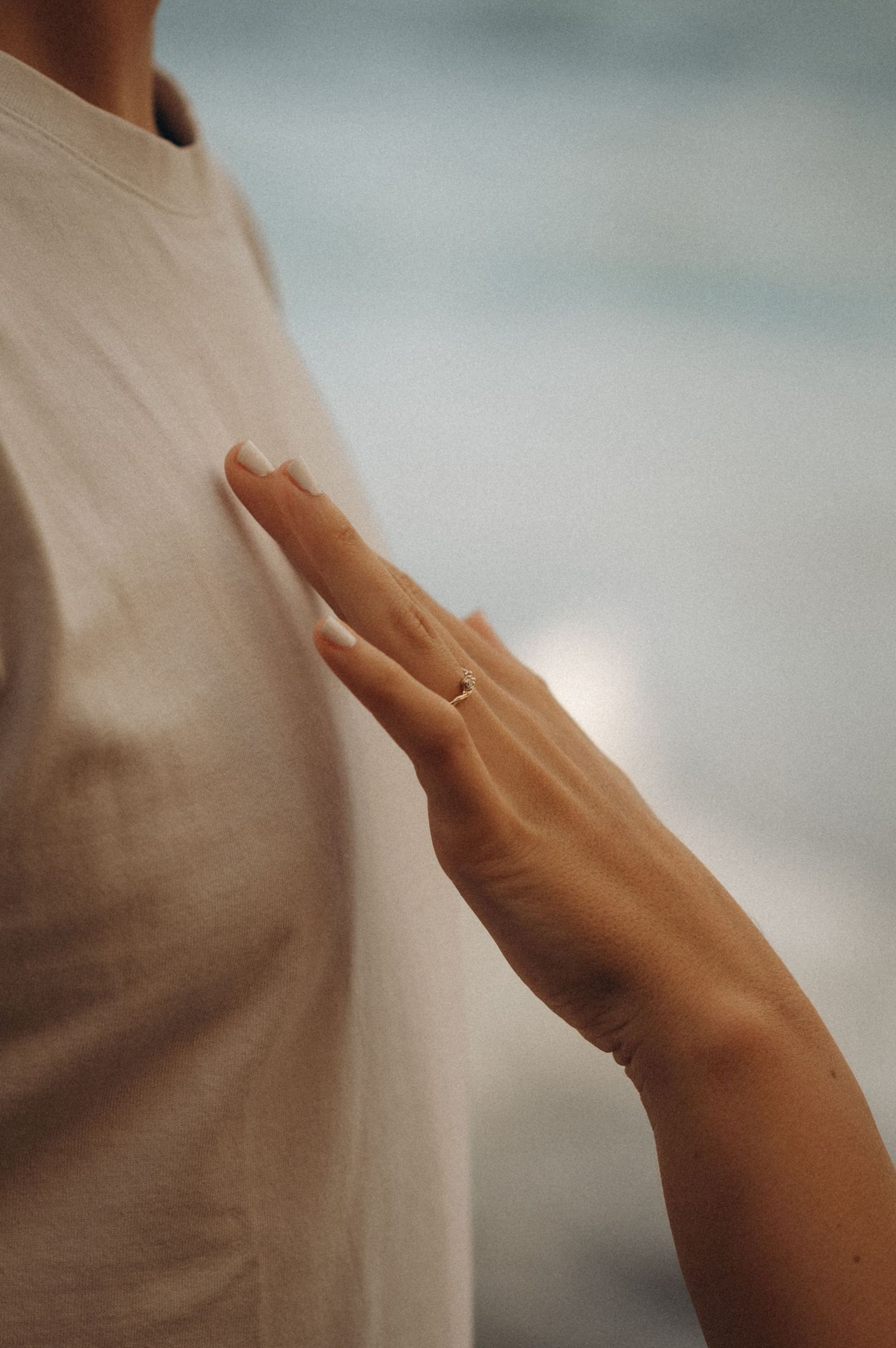 Tender moment close up with her hand on his chest displaying engagement ring at Playa Guios, Los Gigantes, Tenerife