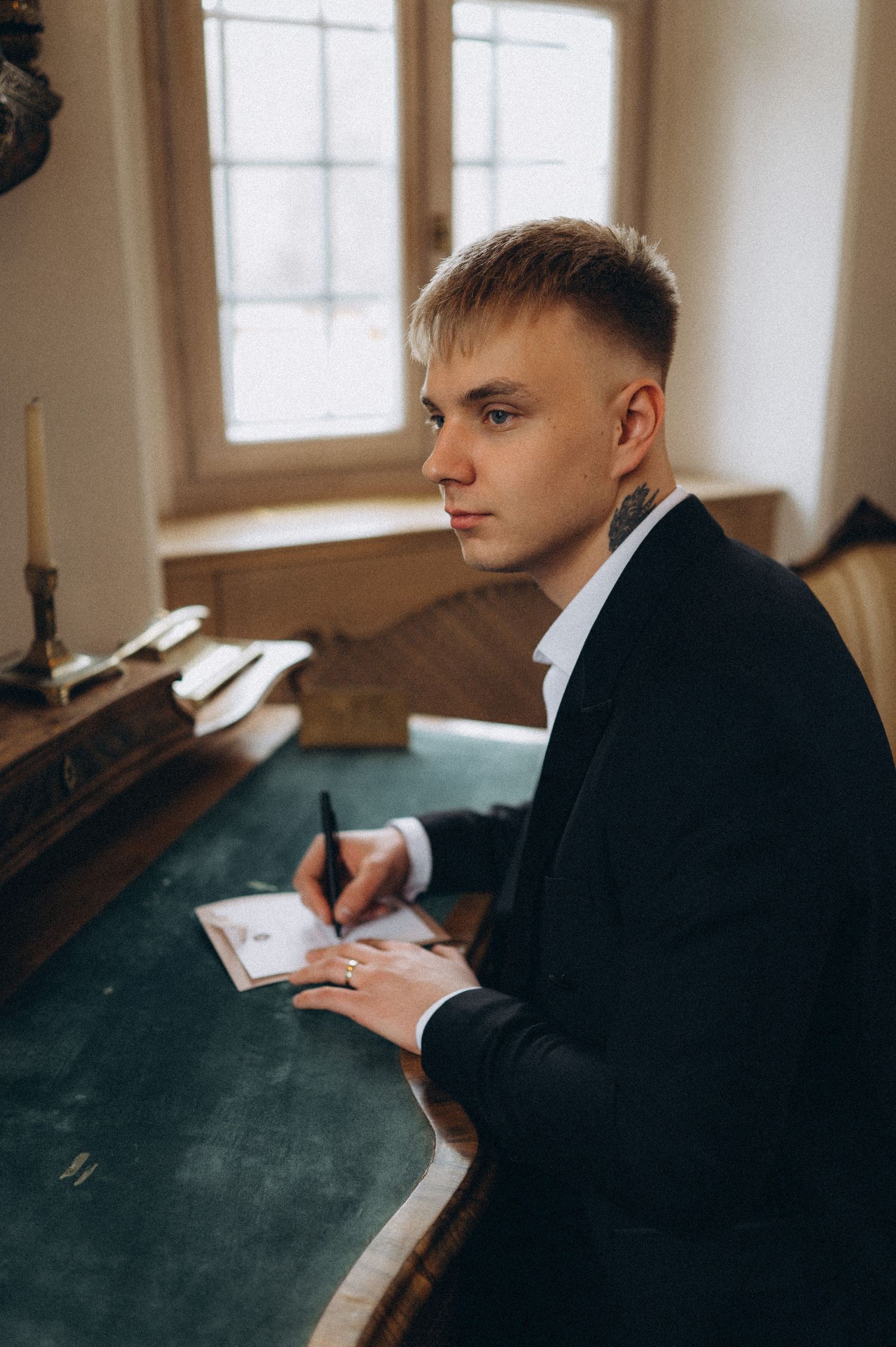 Groom preparing his wedding vows during a quiet and emotional wedding moment.