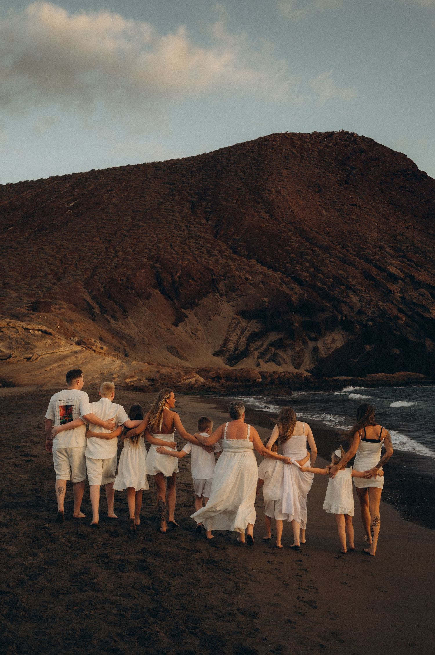 Large family photoshoot on black sand beach in Tenerife at Playa de La Tejita.