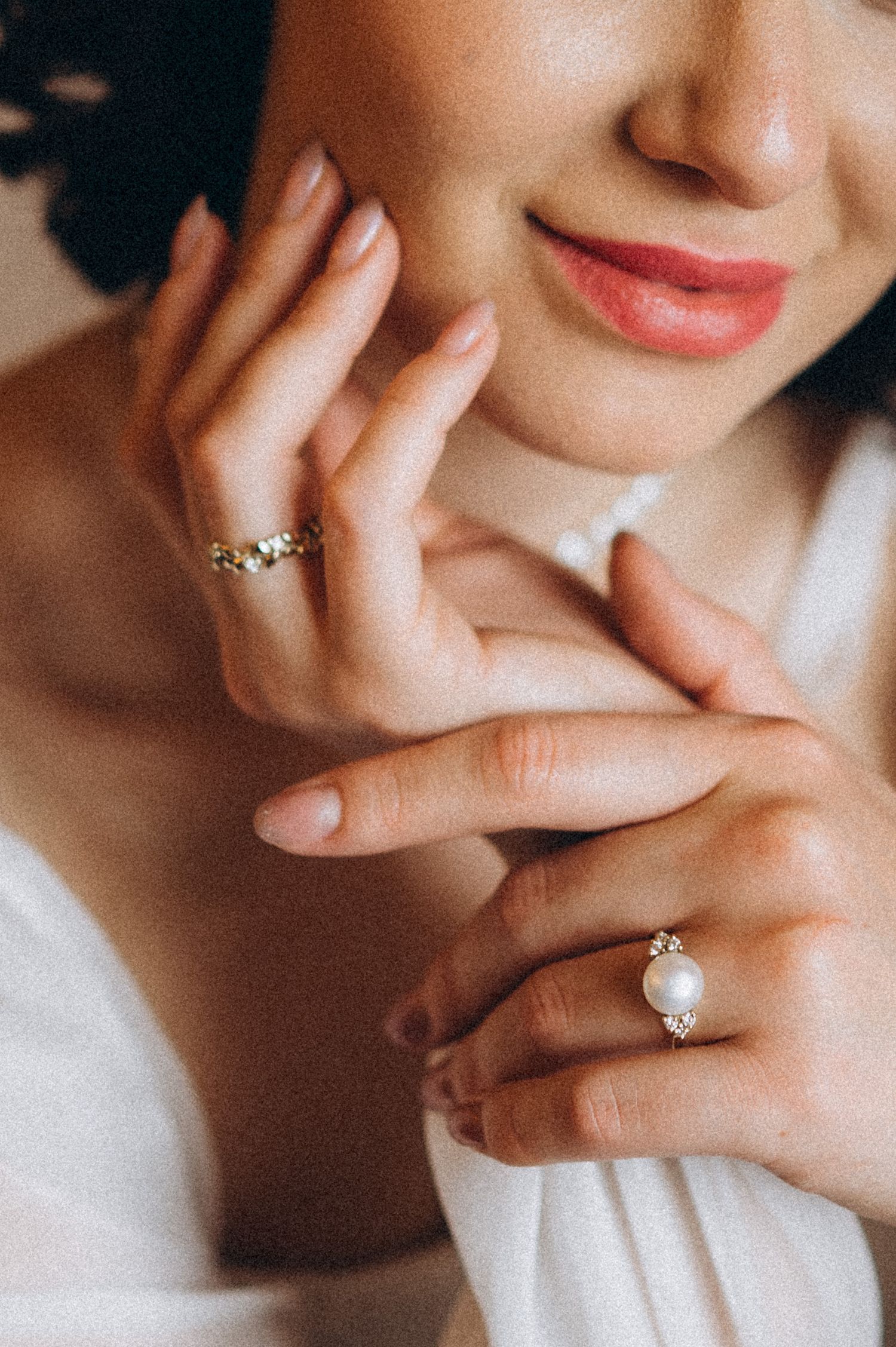 Close-up of the bride's hands showing her engagement ring during a bridal portrait.