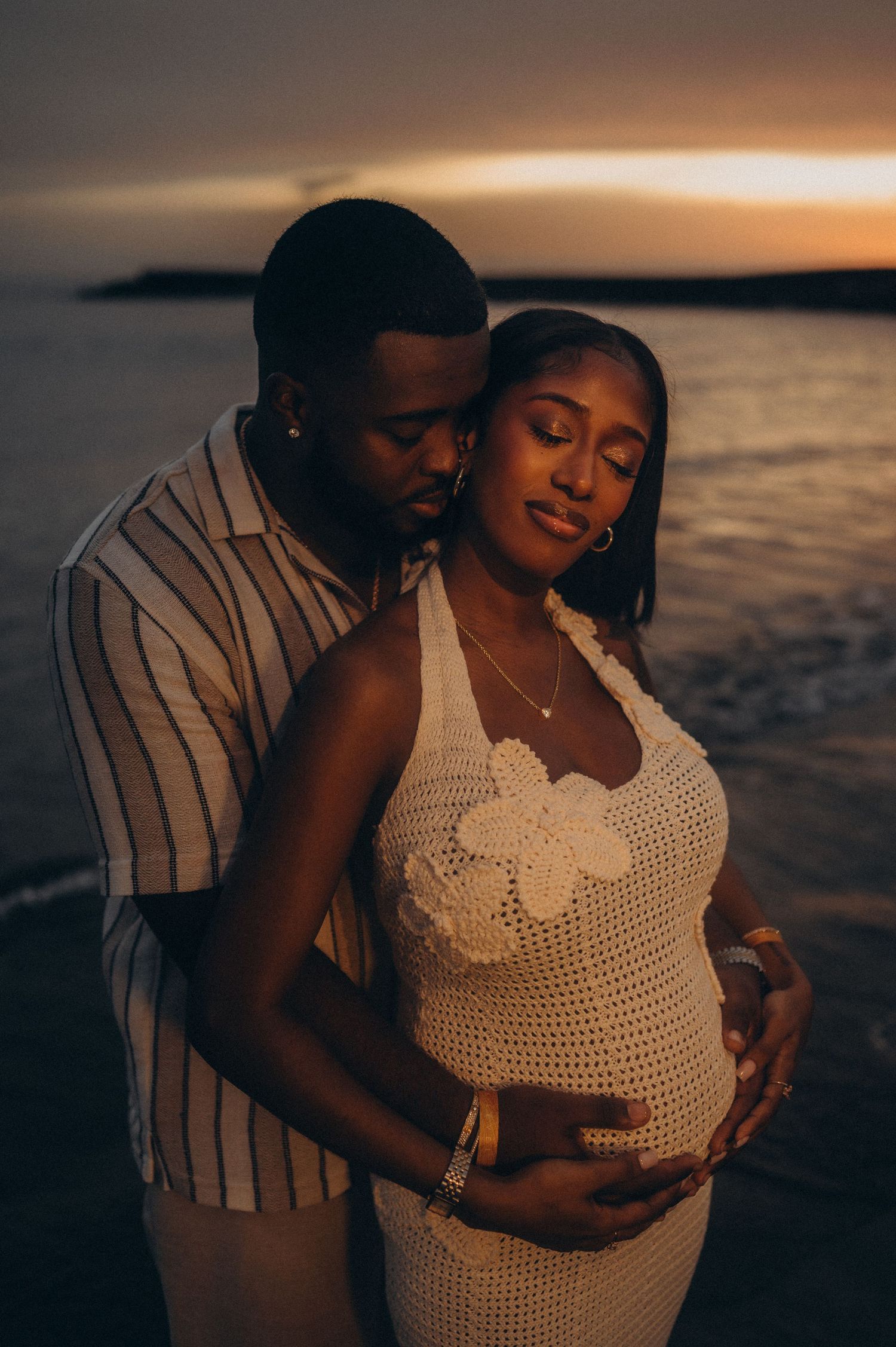 Romantic maternity moment with husband and wife on beach, sunset, Playa Fañabé