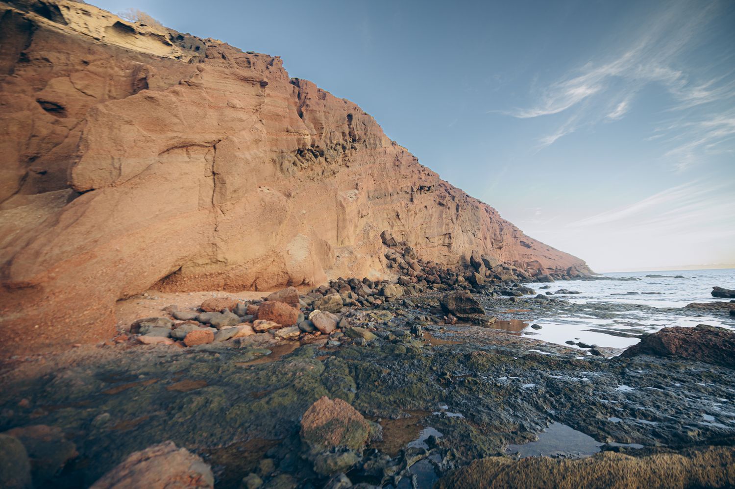 Dramatic rocky formations at Montaña Roja with rugged terrain on Tenerife coastline