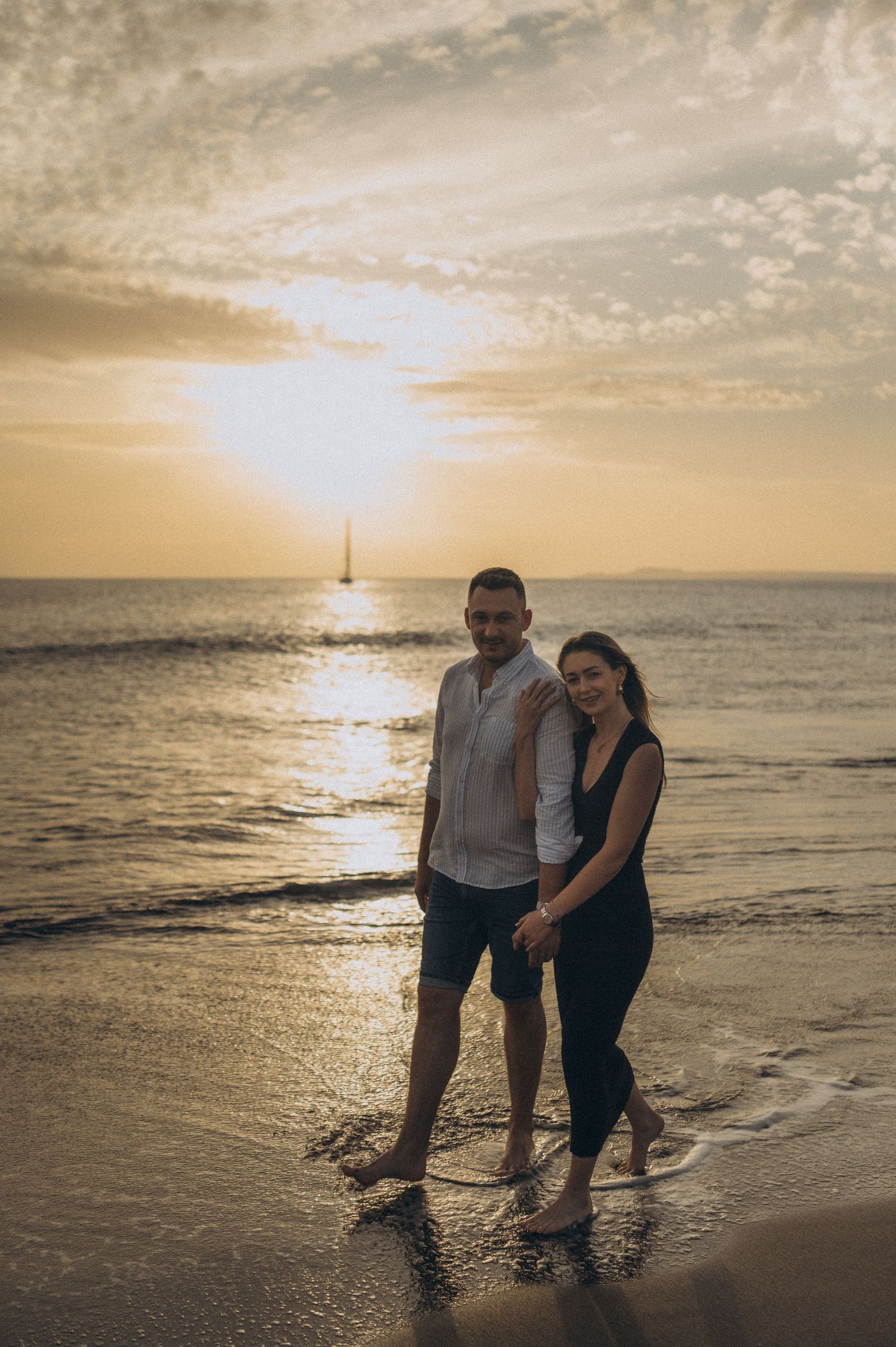 Young couple enjoying seaside walk with Montaña Roja and ocean view, Playa de La Tejita, Tenerife