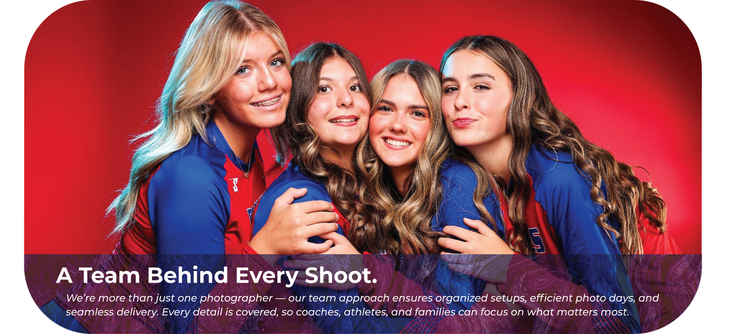 A group of four people smiling and posing together against a vibrant red background.