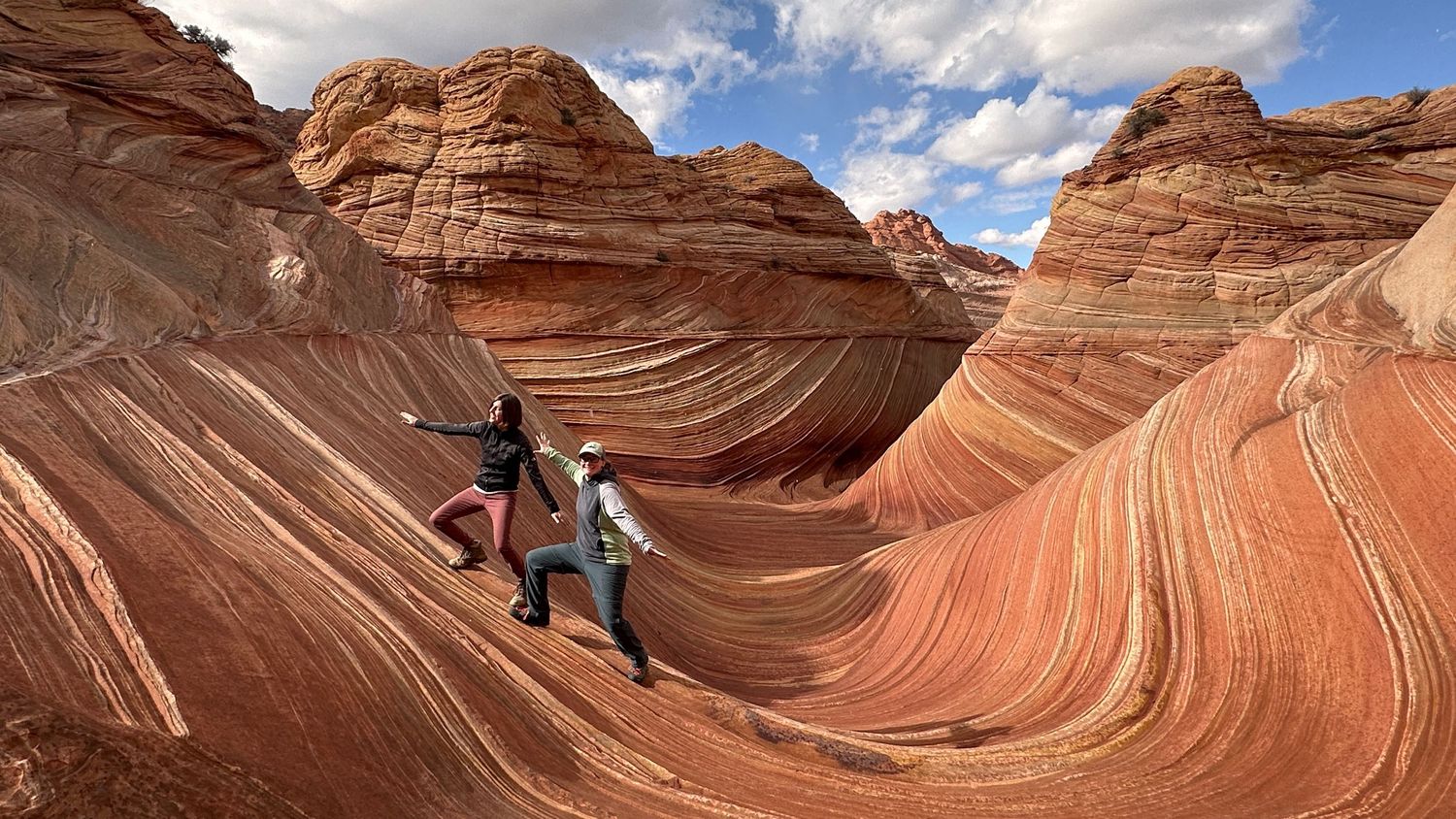 The Wave hike photographer Jenny Casad in colorful sandstone in southwestern Utah/Page, Arizona