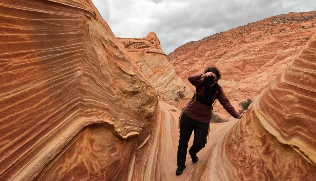 The Wave hike photographer Jenny Casad in colorful sandstone in southwestern Utah/Page, Arizona