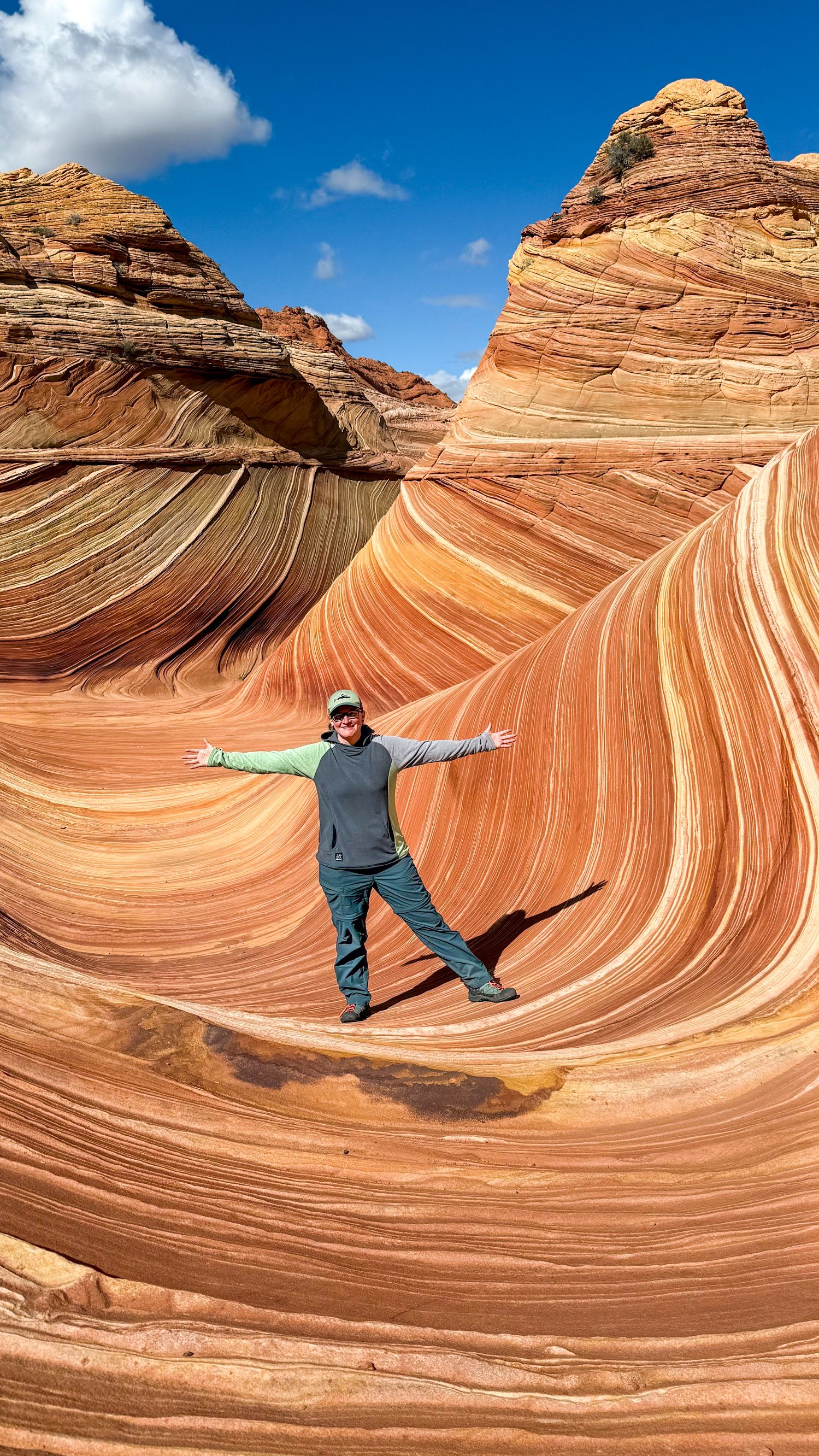 The Wave hike photographer Jenny Casad in colorful sandstone in southwestern Utah/Page, Arizona
