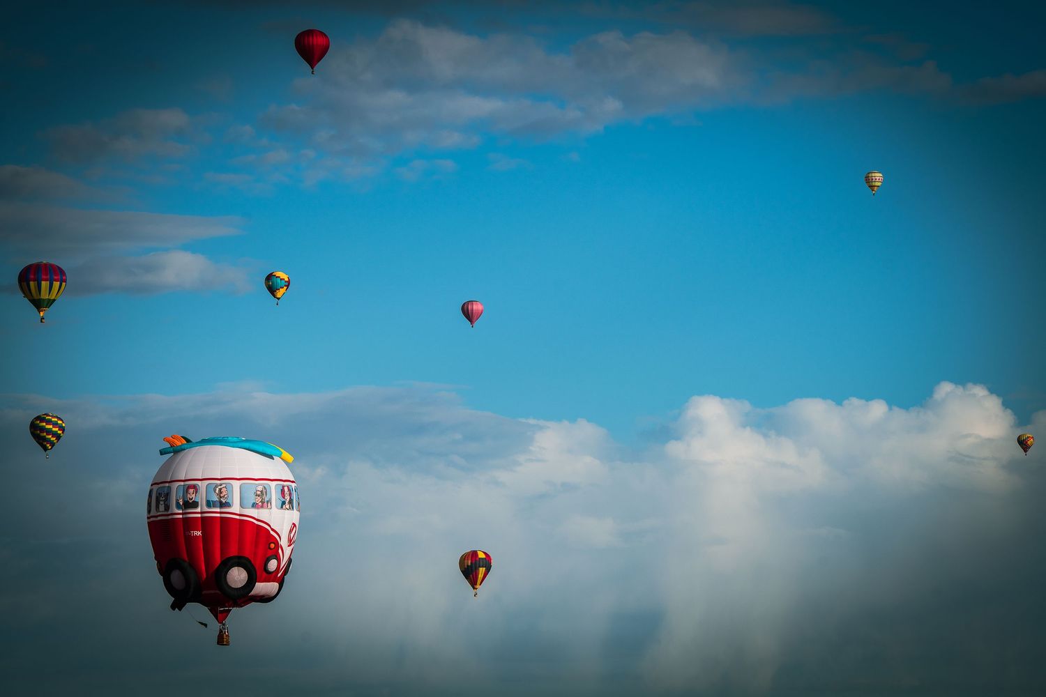 Albuquerque Balloon Fiesta in New Mexico balloons in the blue sky with white clouds