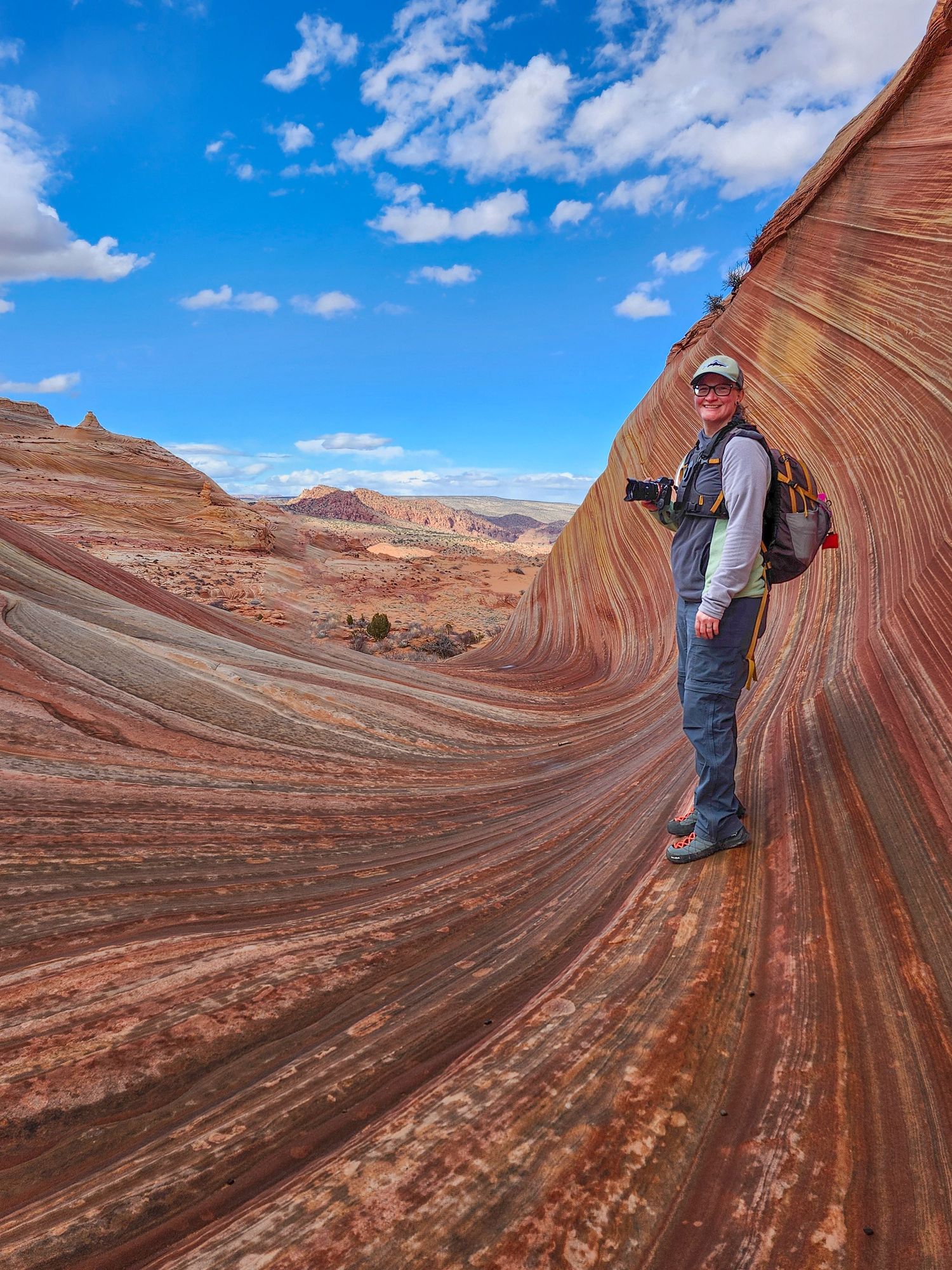 The Wave hike photographer Jenny Casad in colorful sandstone in southwestern Utah/Page, Arizona