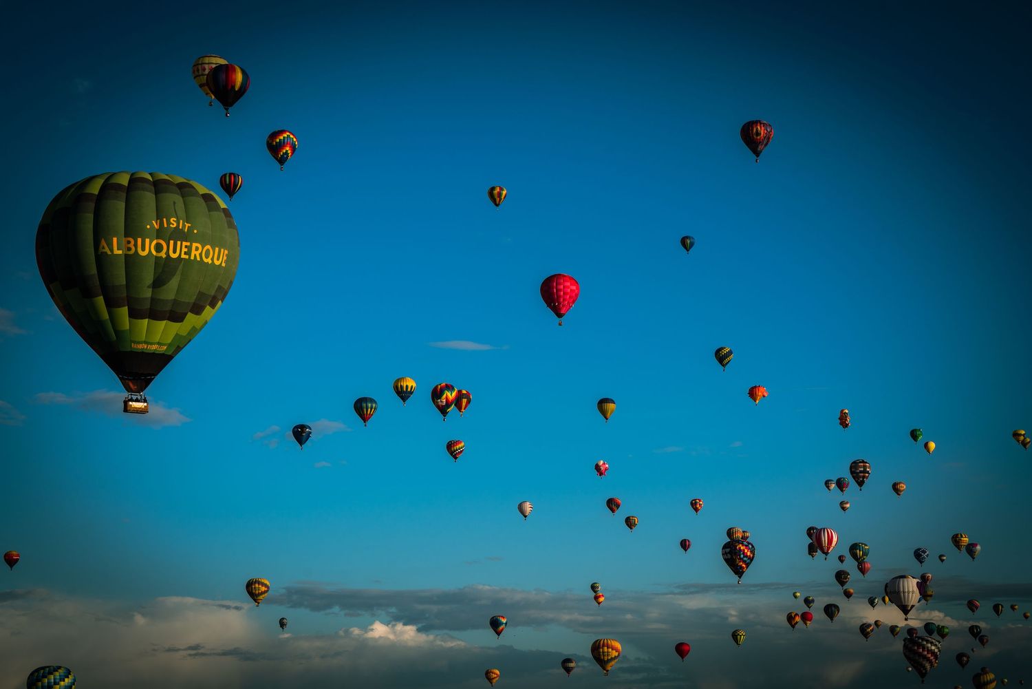 Albuquerque Balloon Feista in New Mexico balloons in the blue sky with white clouds