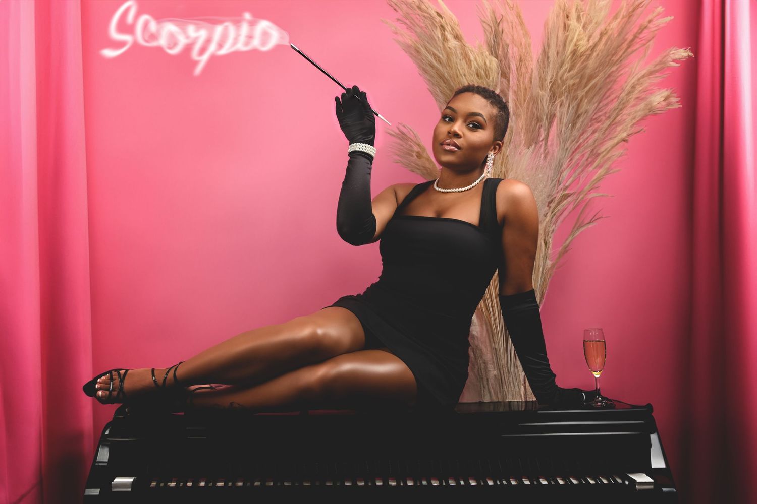 Glamorous photo series against a pink backdrop with dramatic poses. In Tampa Florida.