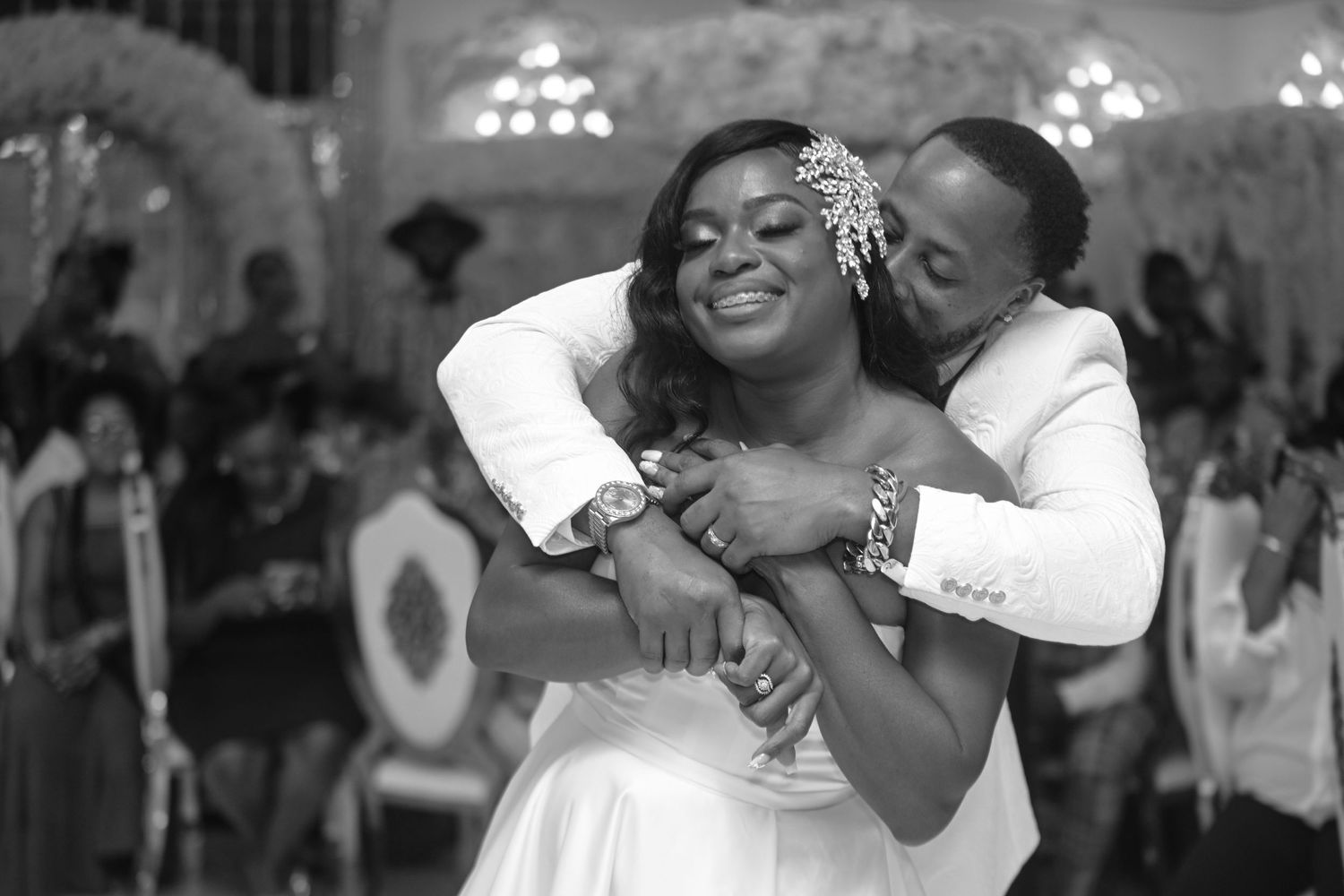 Wedding celebration photos showing joyful dancing moments under elegant chandeliers.