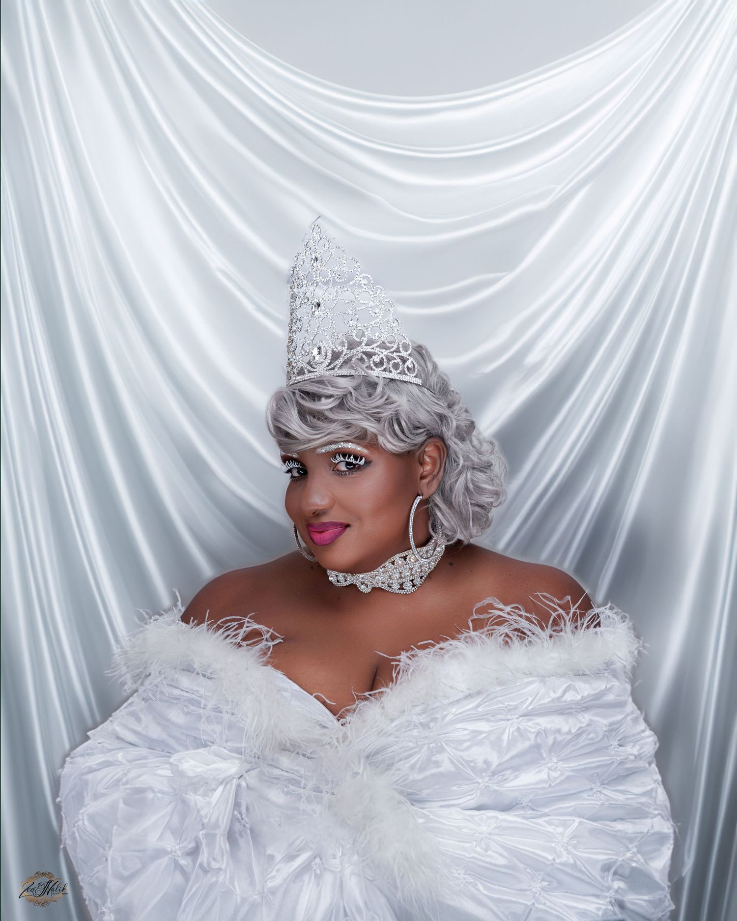 Glamorous full figured portrait series with white draped backdrop featuring elegant styling and dramatic lighting in Tampa Florida.