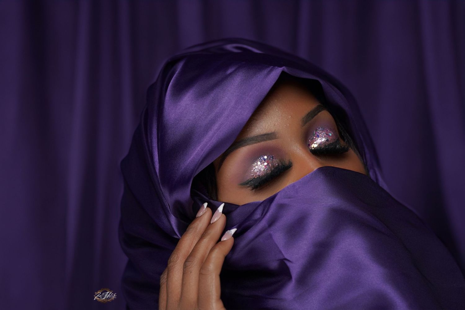 Dramatic portrait series with purple fabric creating mysterious shadows and lighting effects in Saint Petersburg Florida.