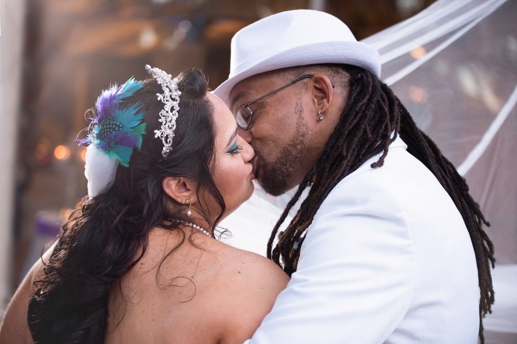 A series of wedding photos showing tender moments between a bride and groom in a garden setting.