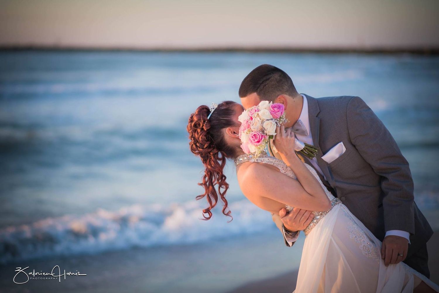 Romantic beach wedding photo series showing couple embracing at sunset with ocean waves in background.