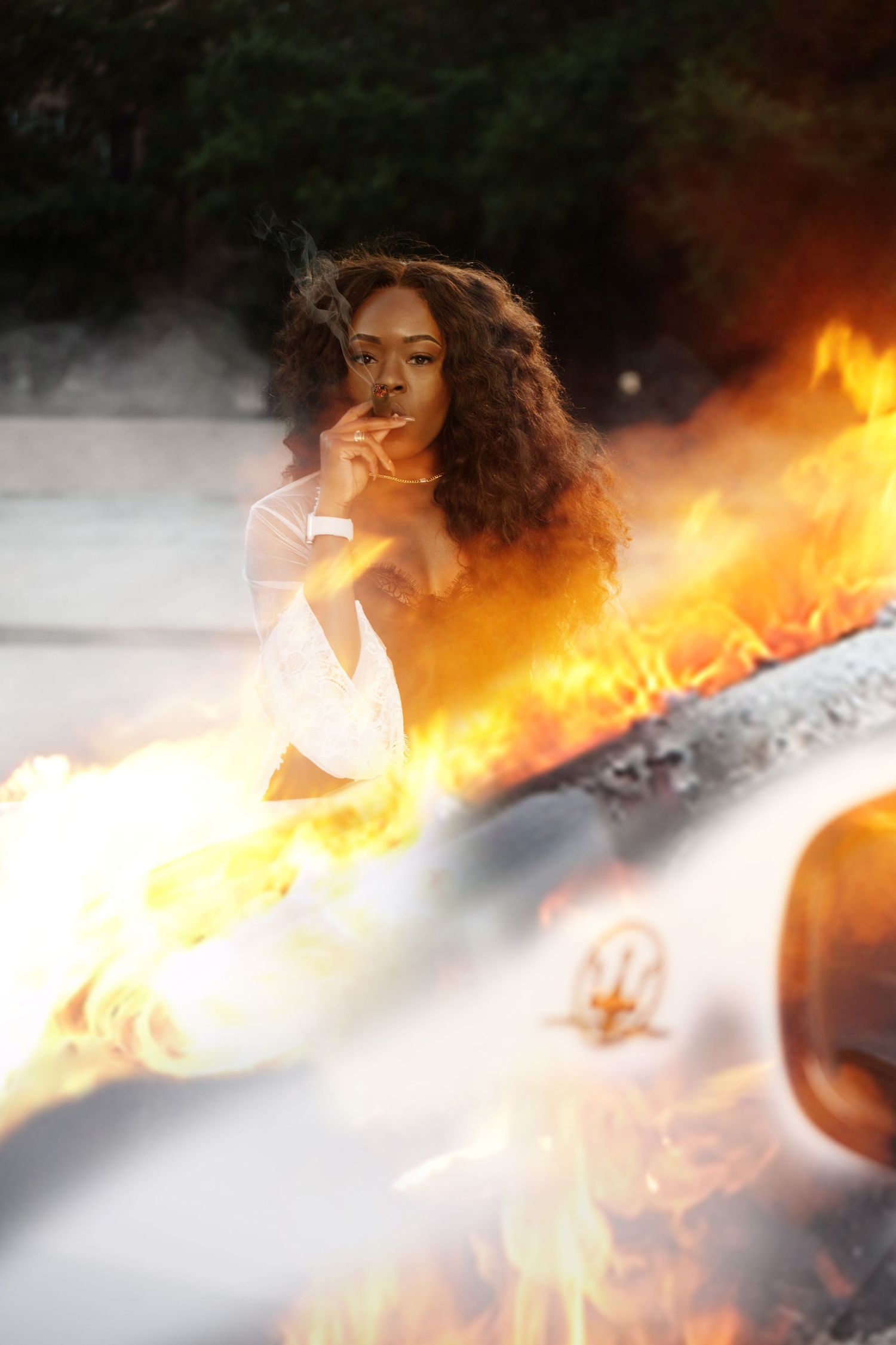 Artistic photo composition featuring fire and smoke effects against dark background. In Tampa Florida.