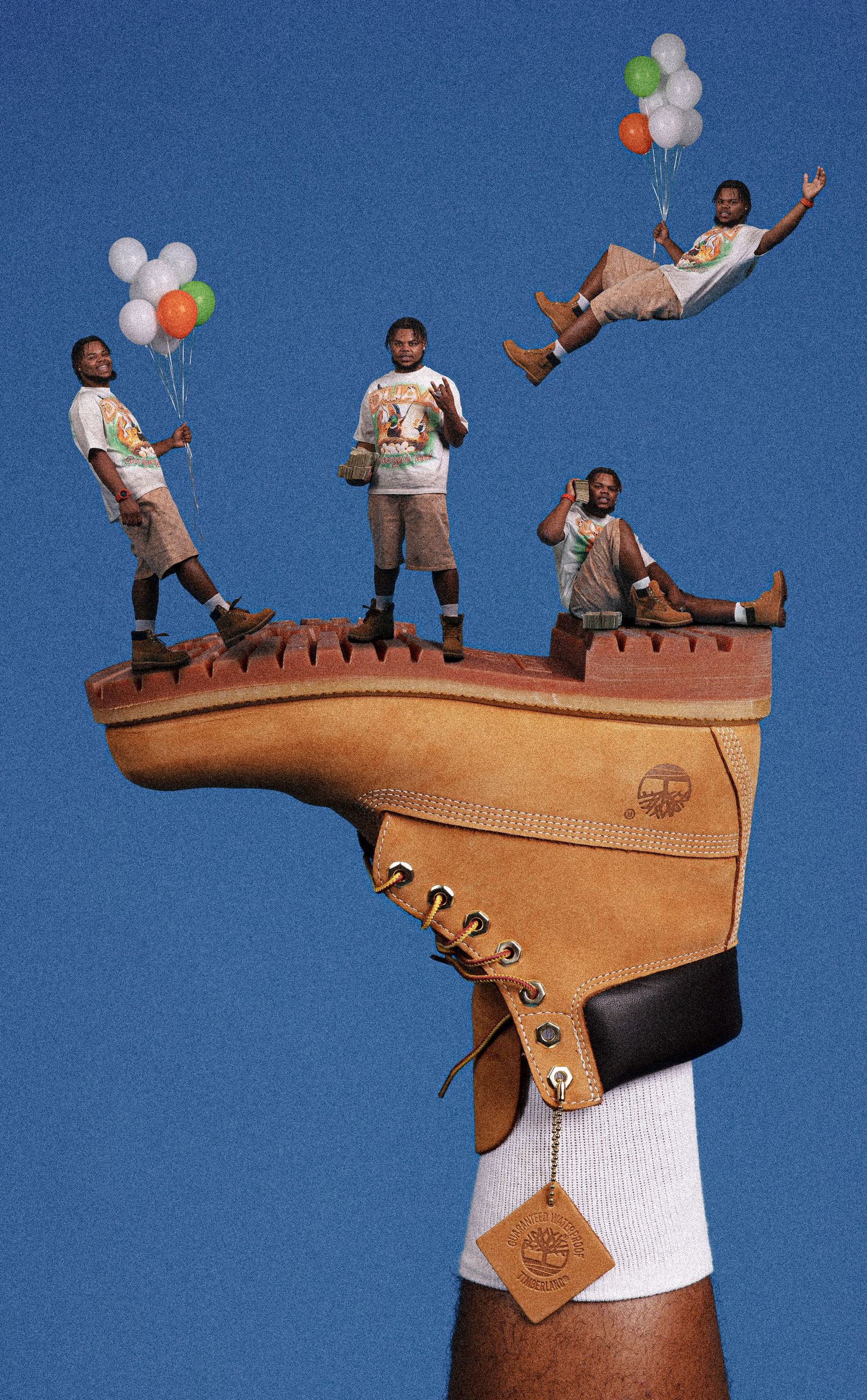 Creative Timberland boot ad with miniature people standing on a giant boot sole, holding balloons against a blue sky.