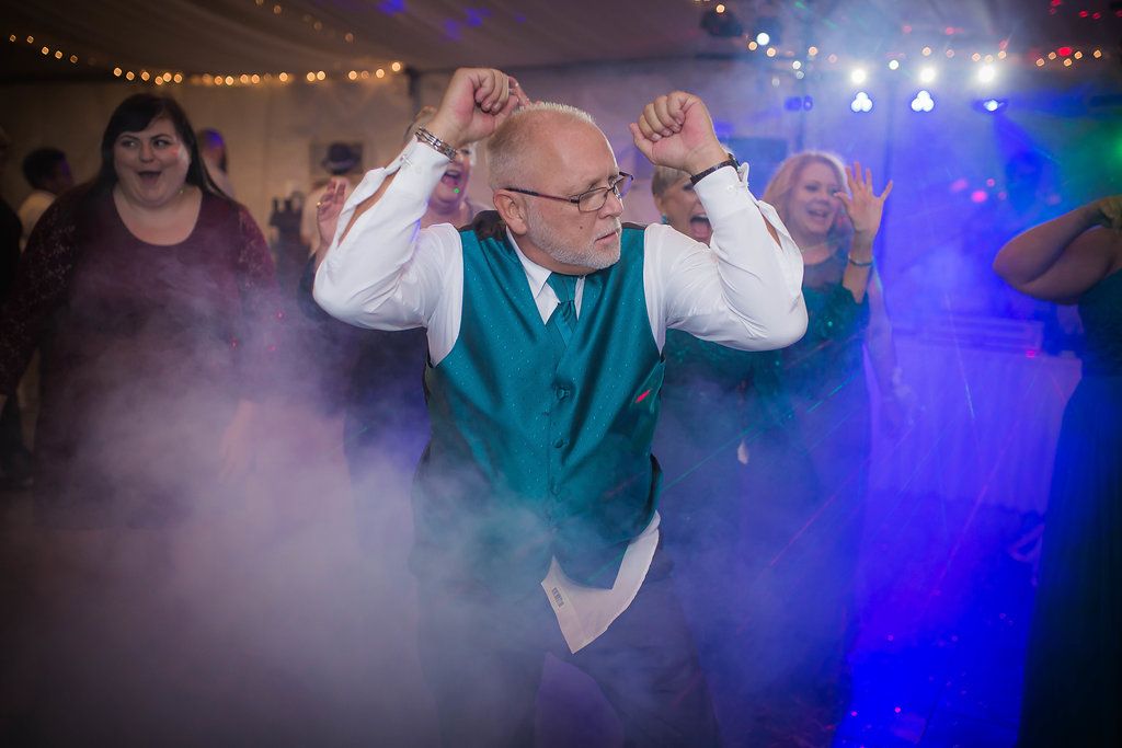 Dance party scene with blue lighting and fog effects on a crowded dance floor in Saint Petersburg Florida.