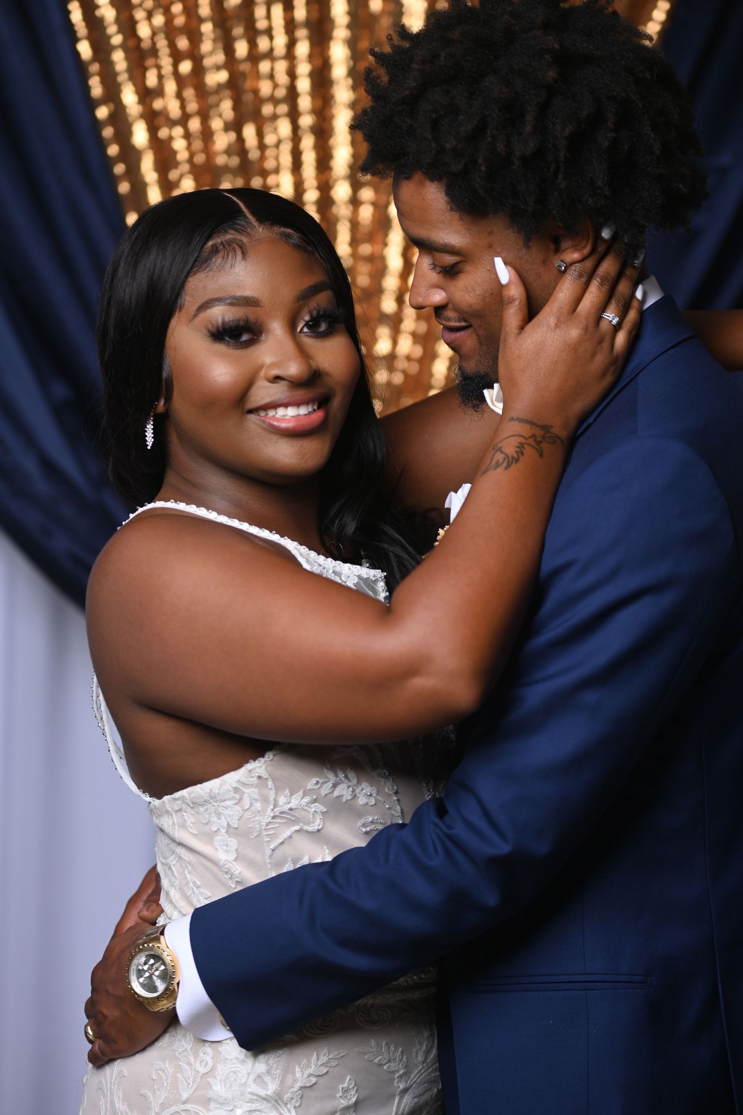 Romantic wedding photo series showing couple embracing in front of sparkling gold backdrop.