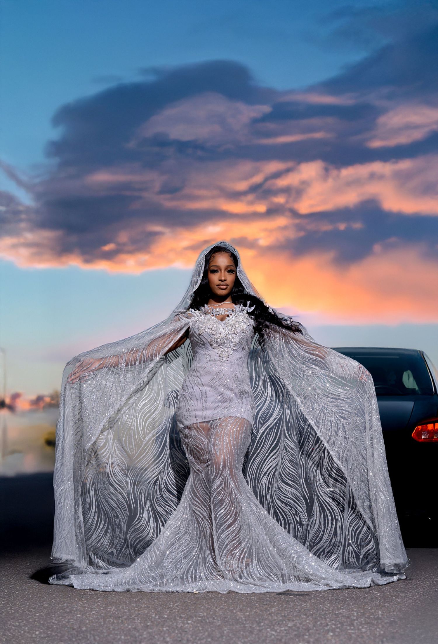 Ethereal bridal portrait in lace gown against sunset sky in Saint Petersburg Florida.