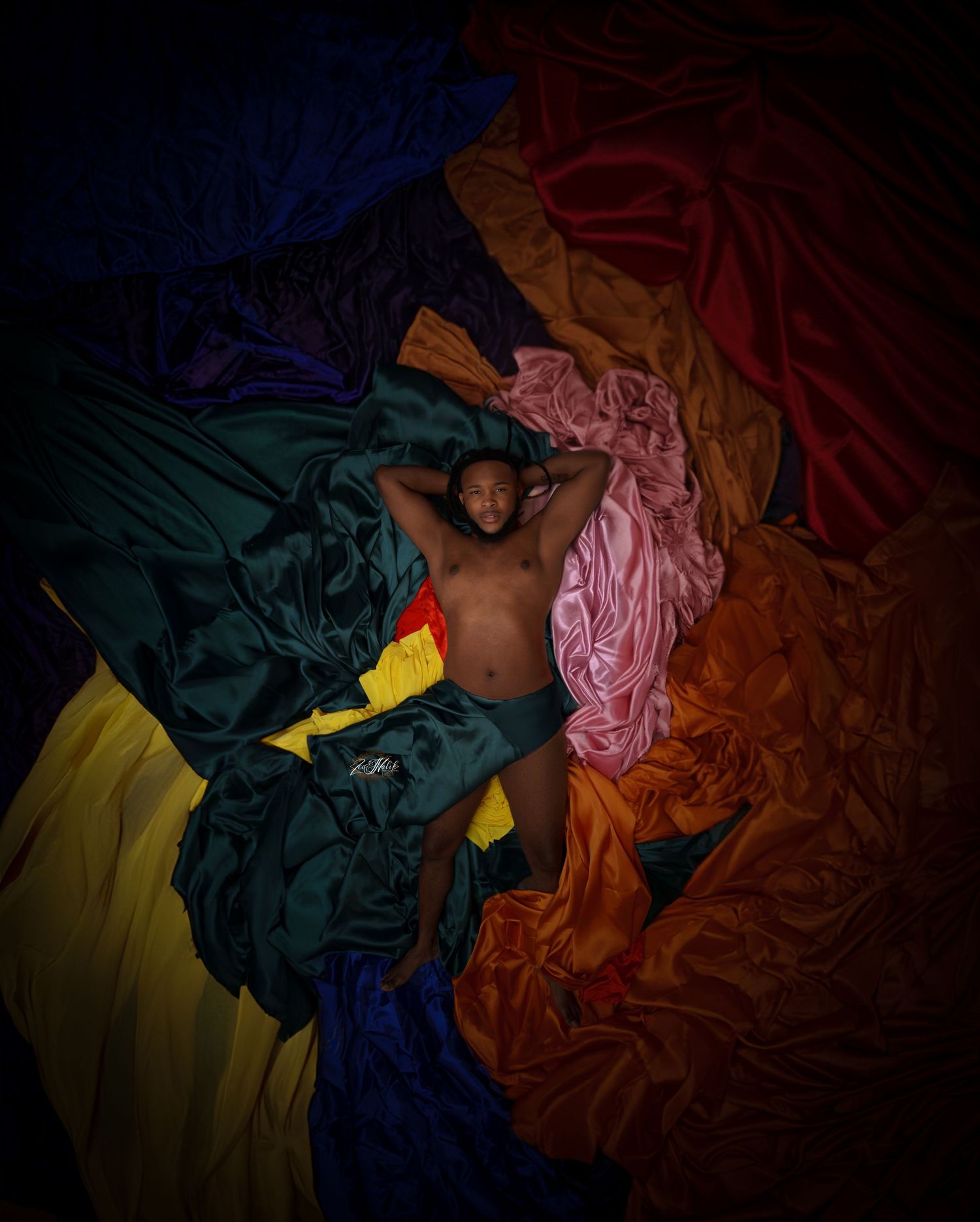 Artistic photo series with colorful draped fabrics in dark lighting creating dramatic shadows and textures in Saint Petersburg Florida.