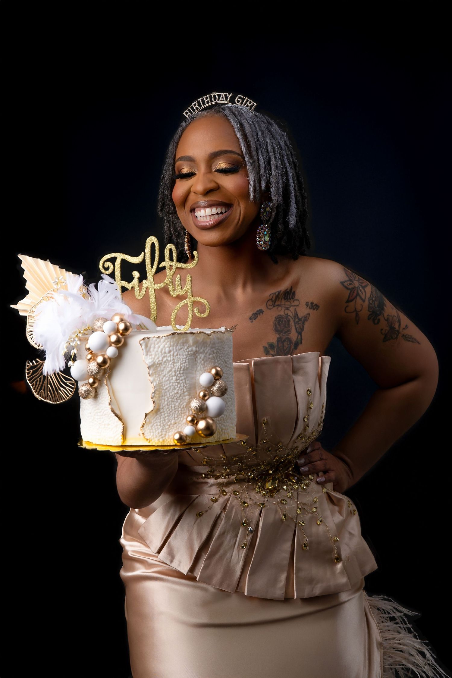 Joyful celebration photo with elegant cake and champagne gold decorations in Saint Petersburg Florida.